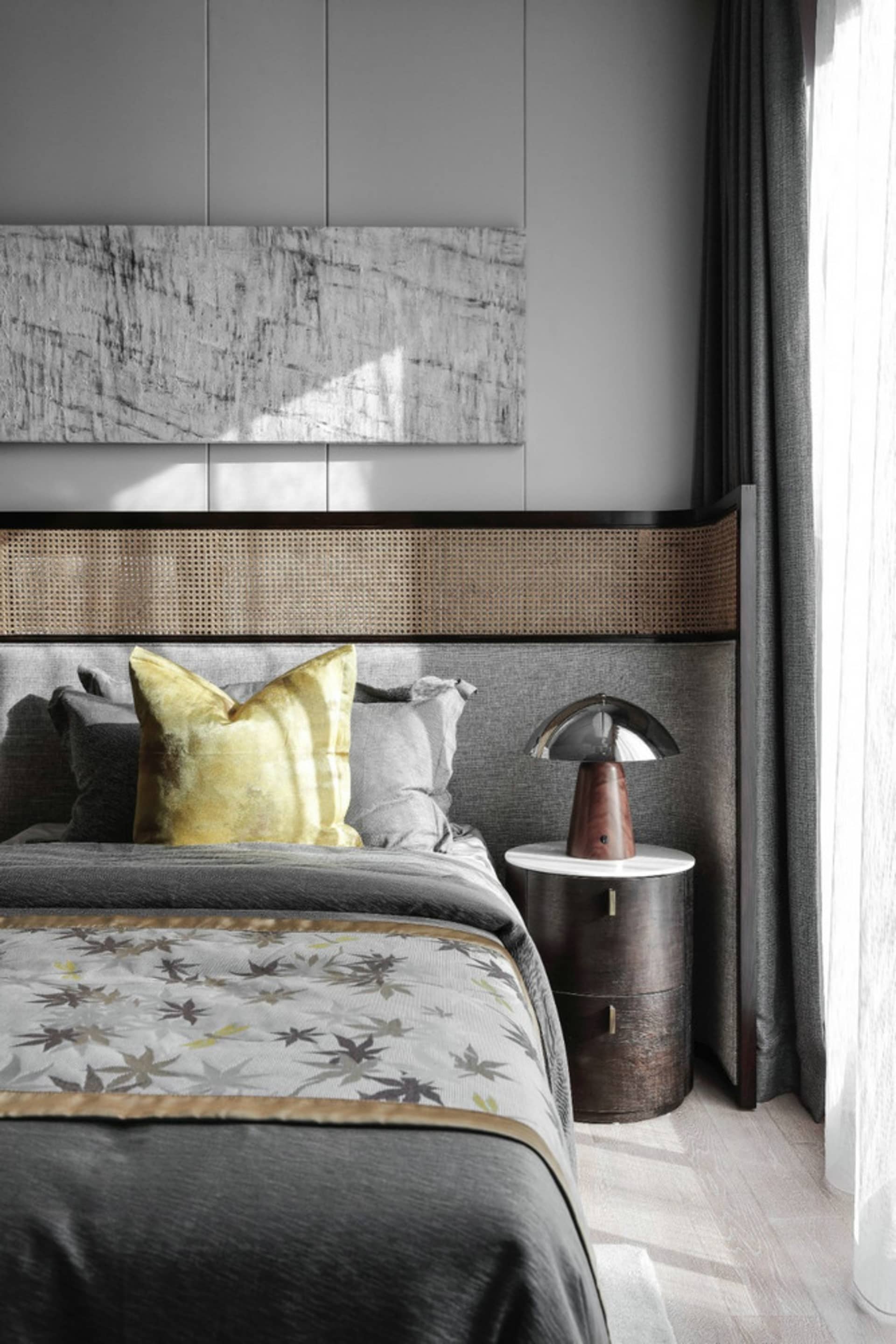 Modern bedroom featuring textured wood headboard and rattan accents