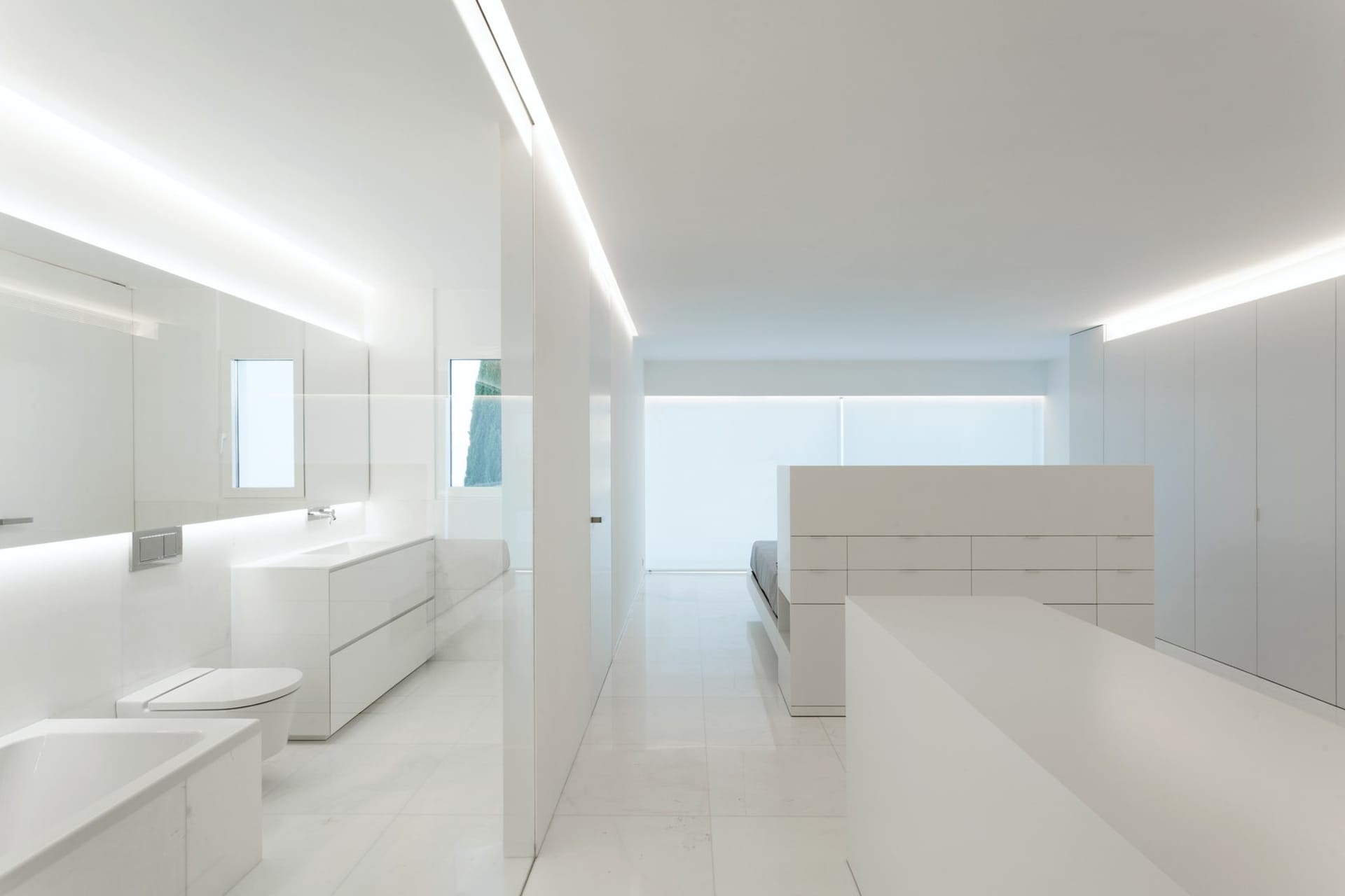 A modern minimalist bathroom with white tiles and construction.