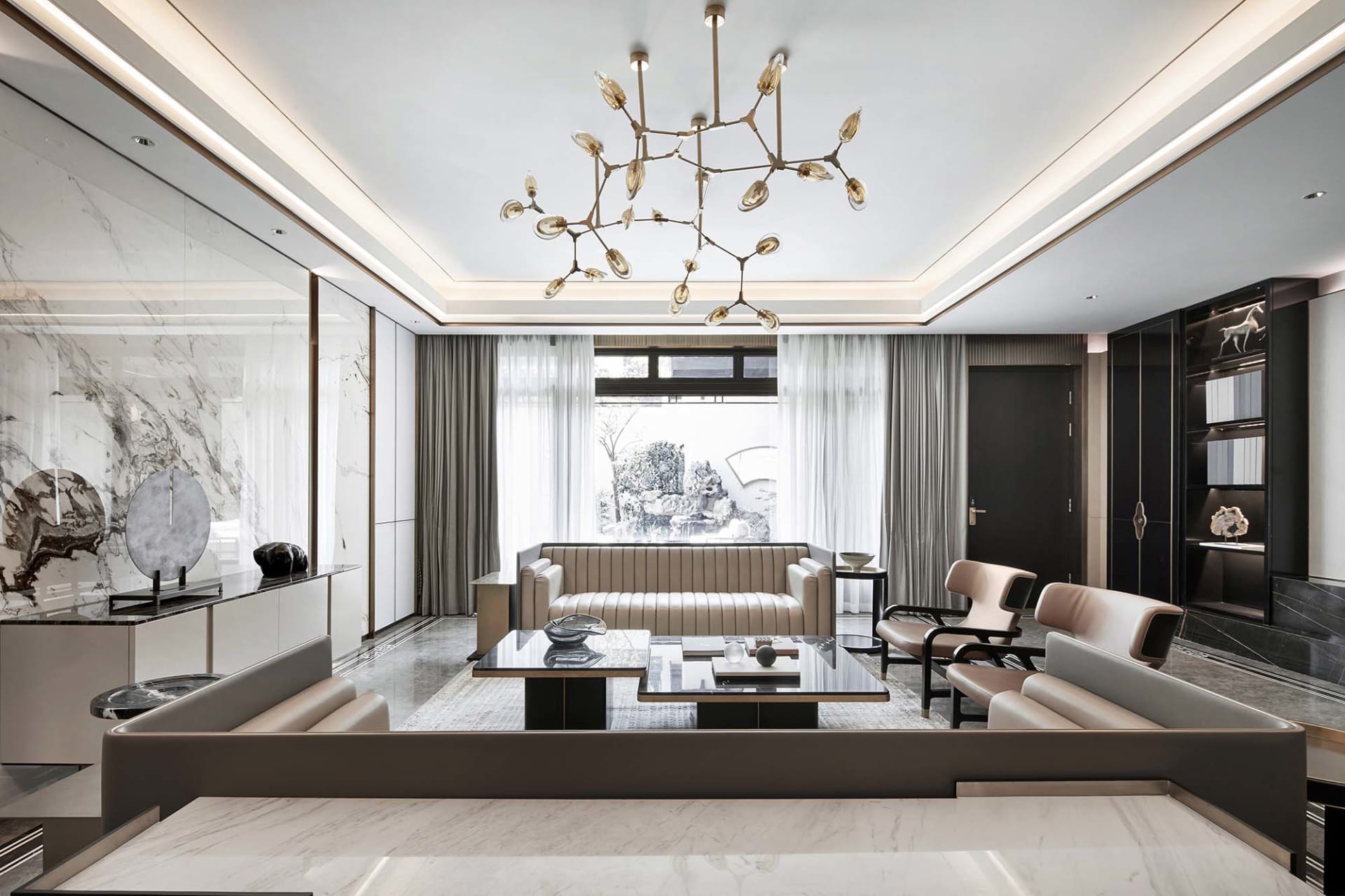 Modern living room featuring a marble floor, a contemporary sofa, and a glass table.