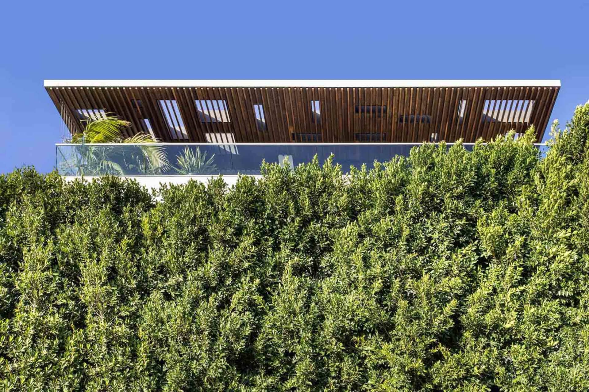 Modern residential home featuring a contemporary exterior with wooden elements.
