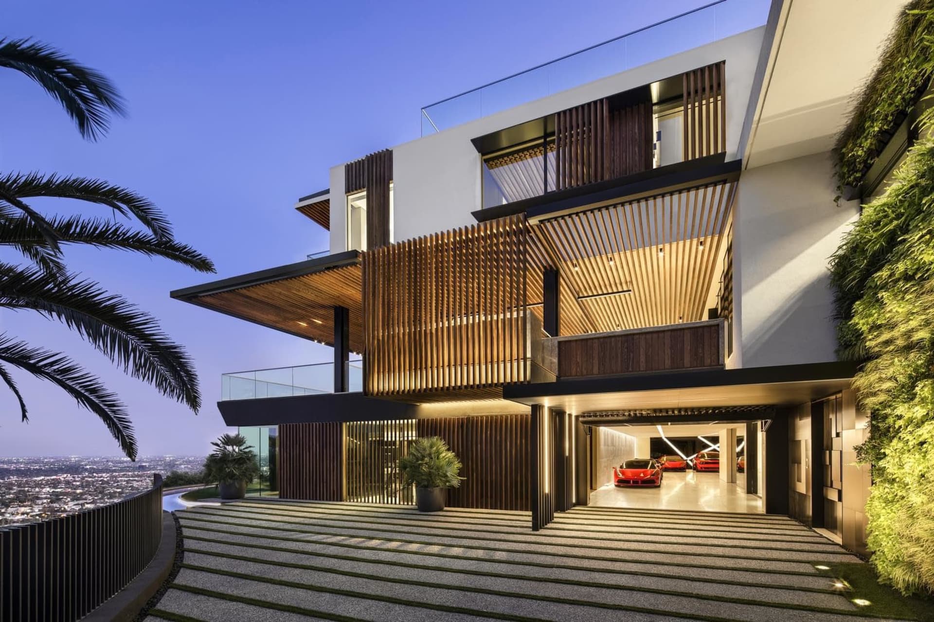Modern house exterior featuring natural wood, glass, and metallic elements.