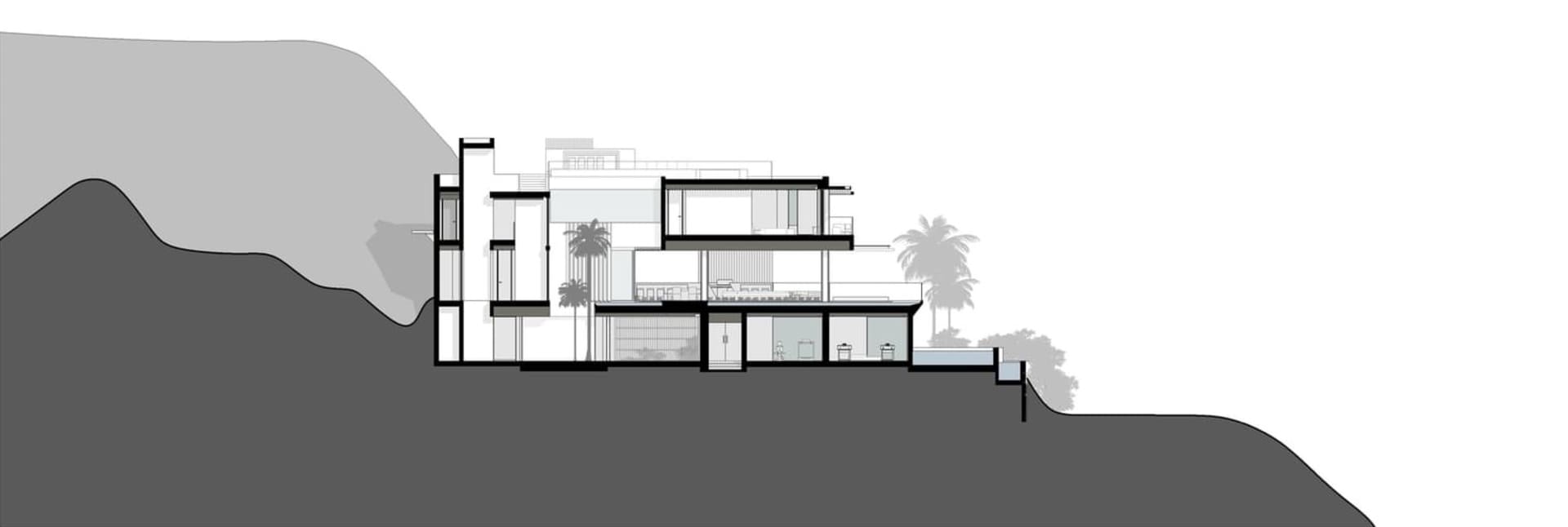 A modern residential architecture with flat roof and sea view.