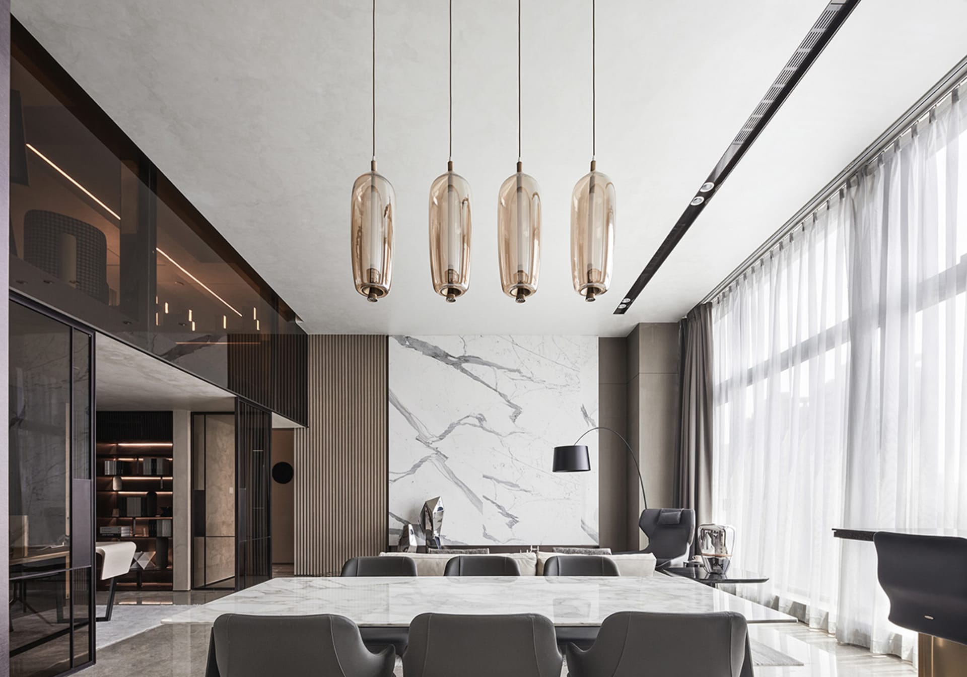 Modern dining room featuring marble, glass, and metal elements.