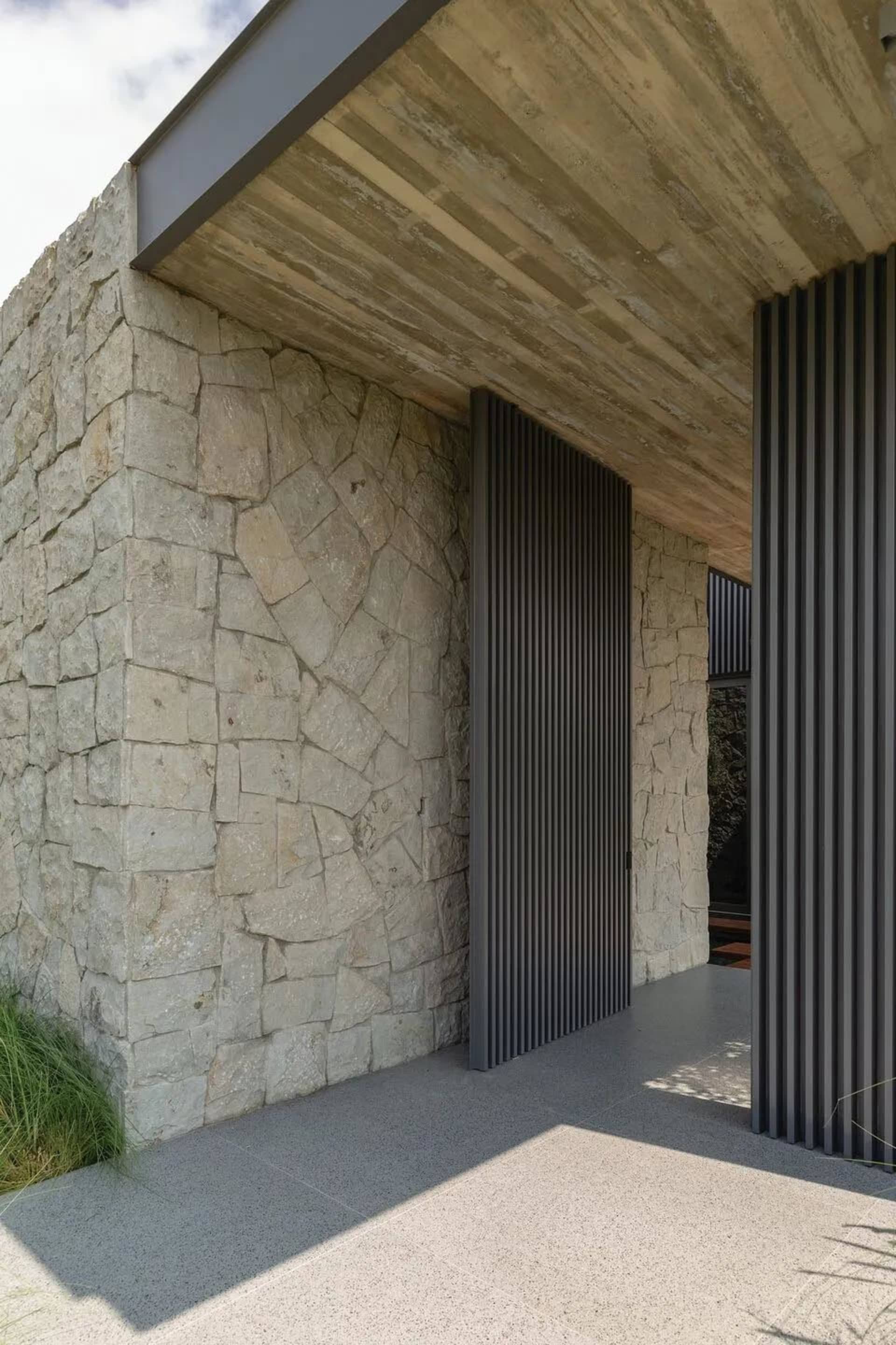 Concrete and stone entryway with a modern design.