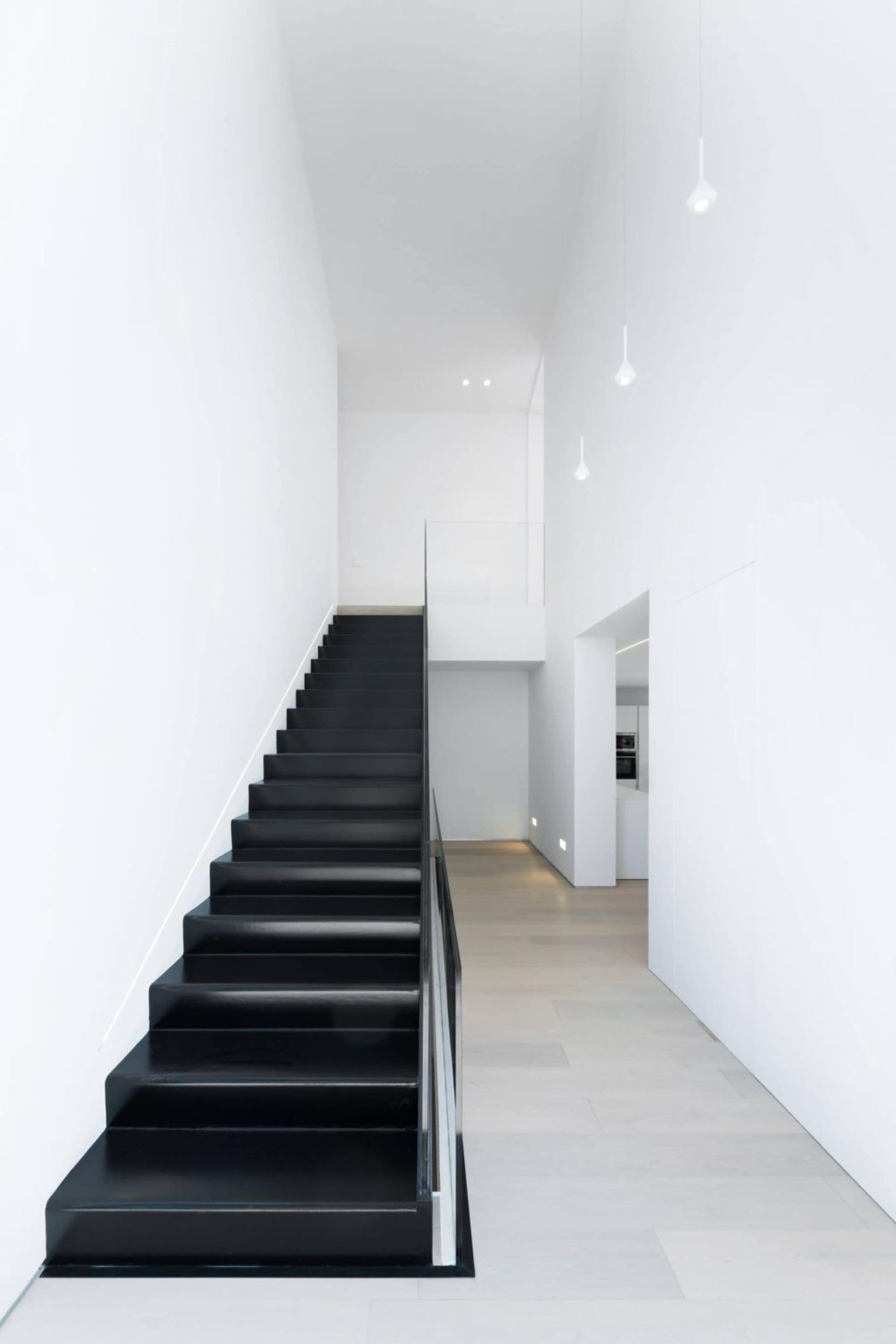 Modern black stairs with white walls interior design