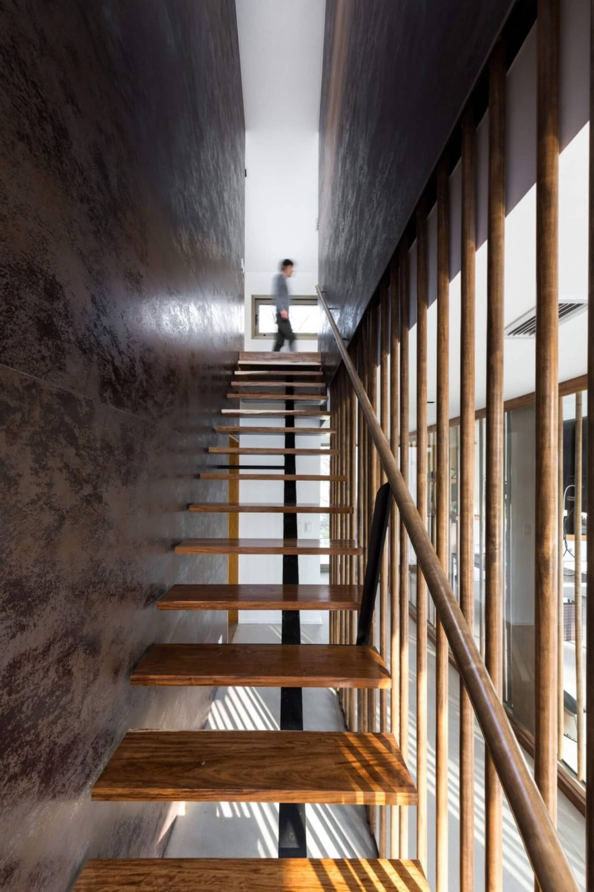 Modern wooden stairs with industrial design elements in an interior space.