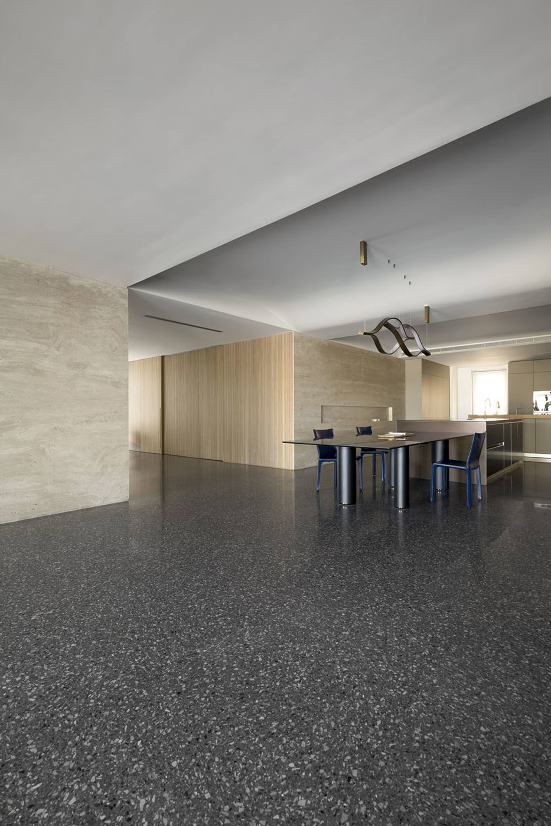 Modern dining room featuring a concrete floor and minimalist design.