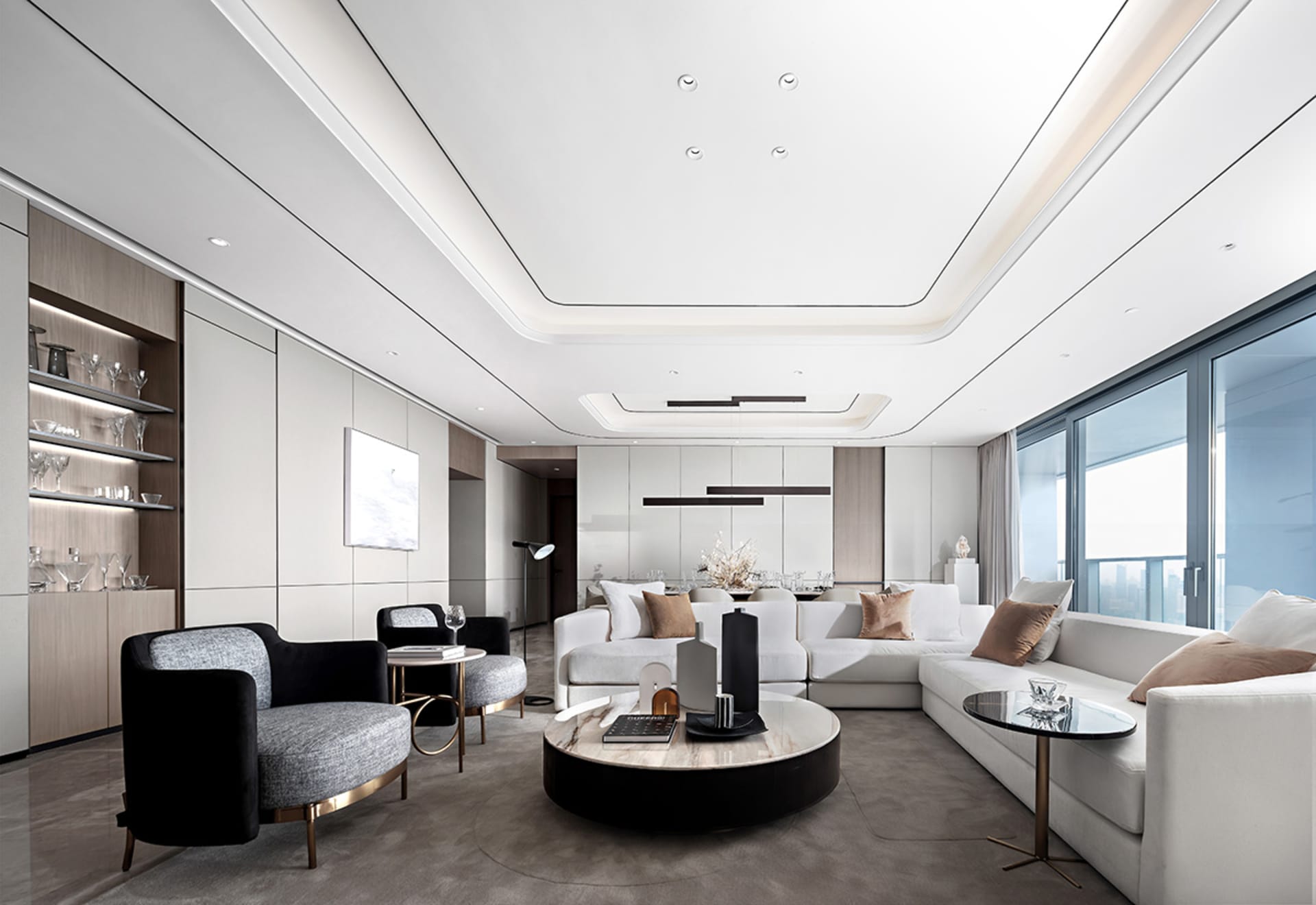 A modern living room with white and black furniture and minimalistic decor.