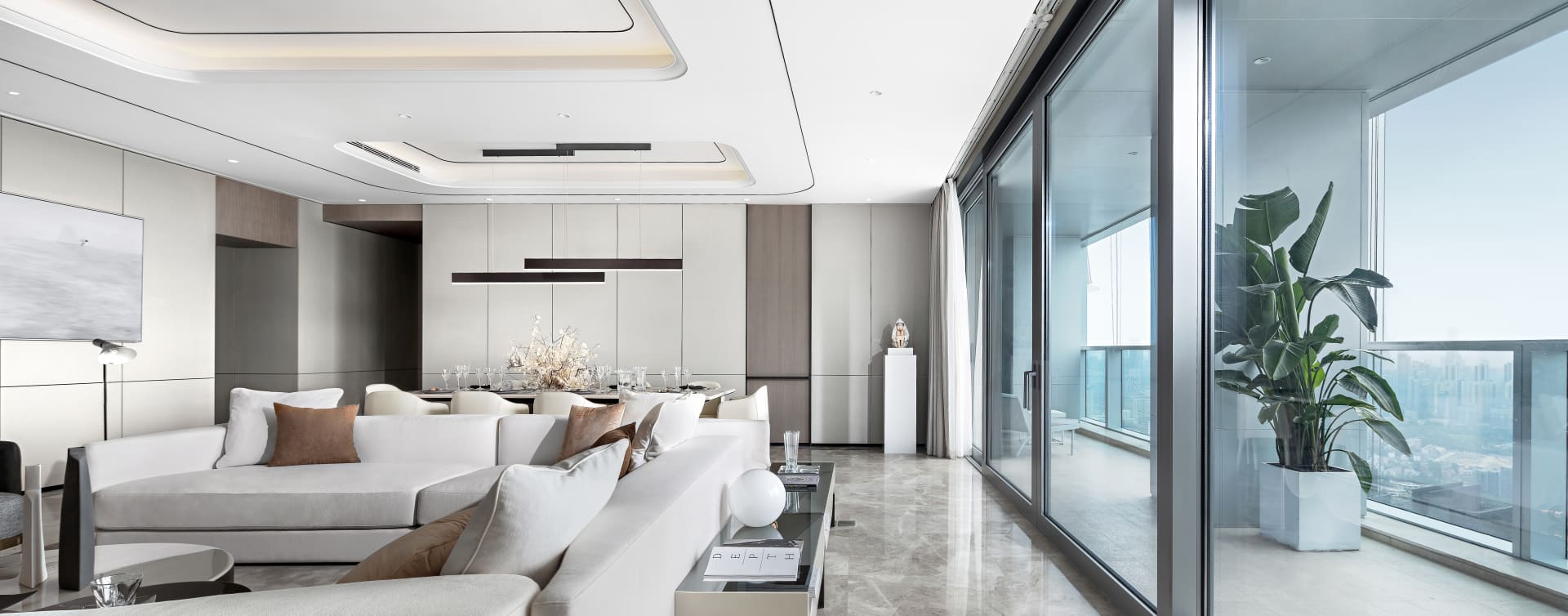Modern living room featuring glass and marble elements