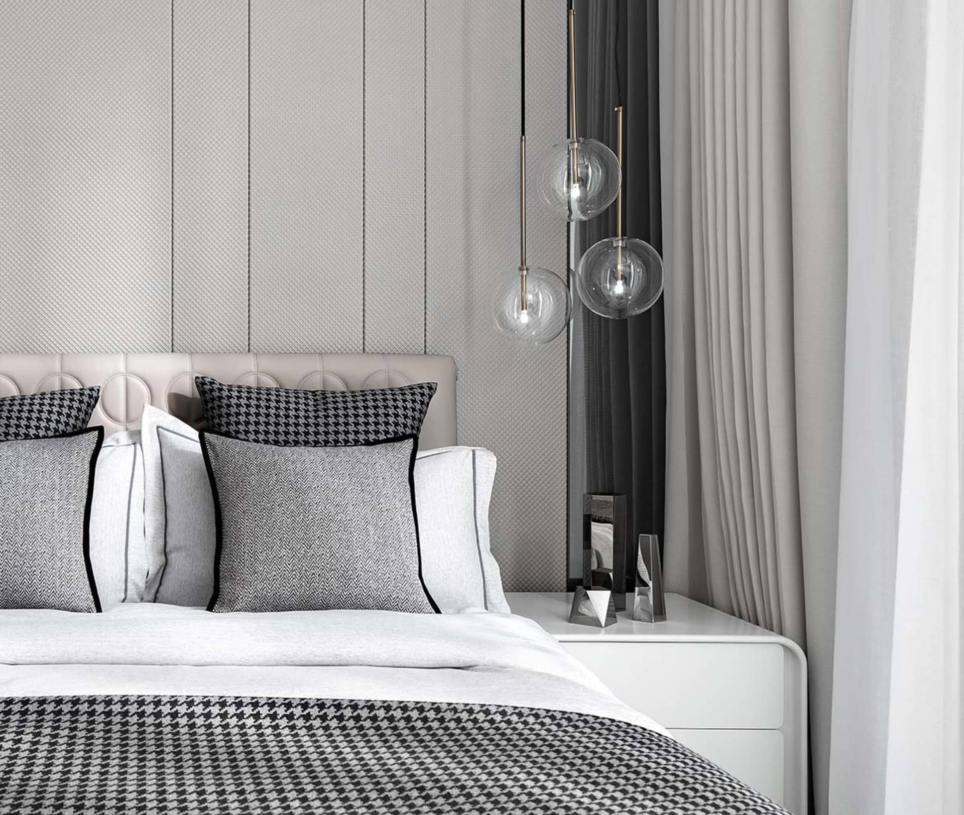 Modern minimalist bedroom featuring textured fabric curtains, a padded textile headboard, and pendant glass lighting fixtures