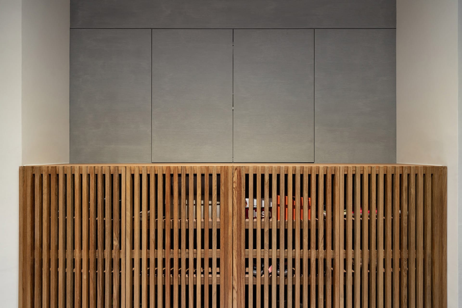 A modern storage cabinet with wood slats and a sleek, minimalist design.