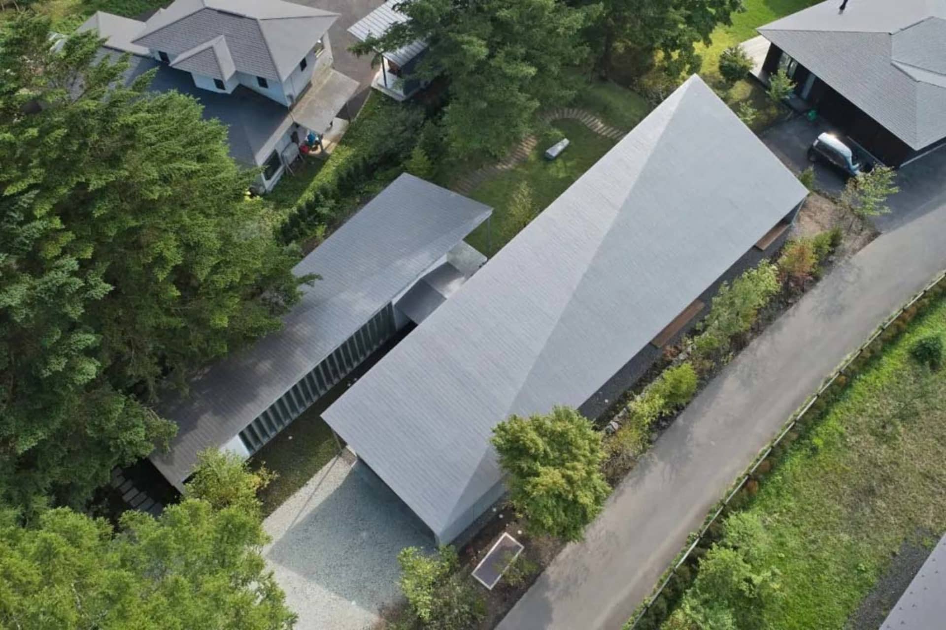 Aerial view of modern residential buildings with a metal roof