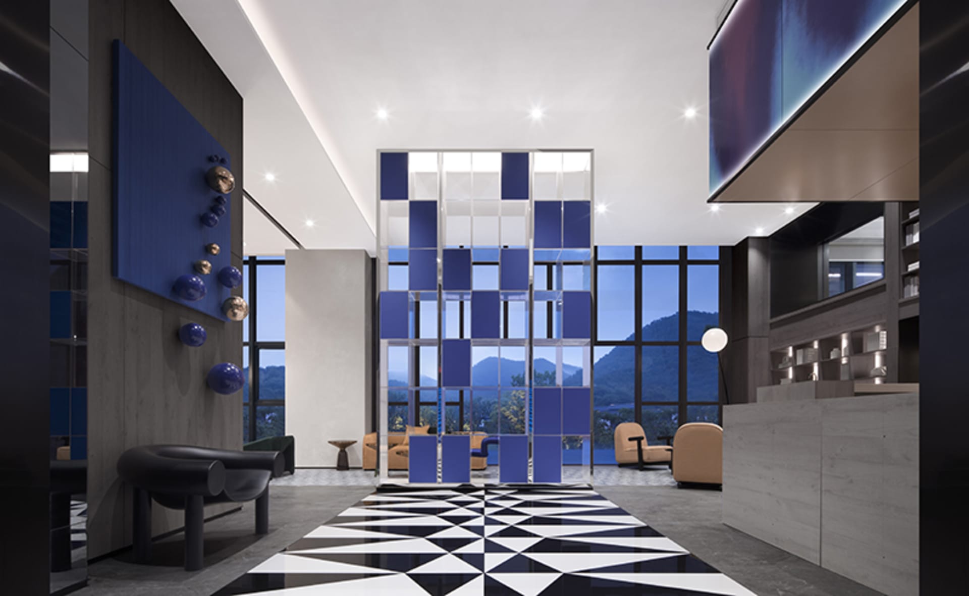 Modern hotel lobby featuring glass partitions and metal chairs