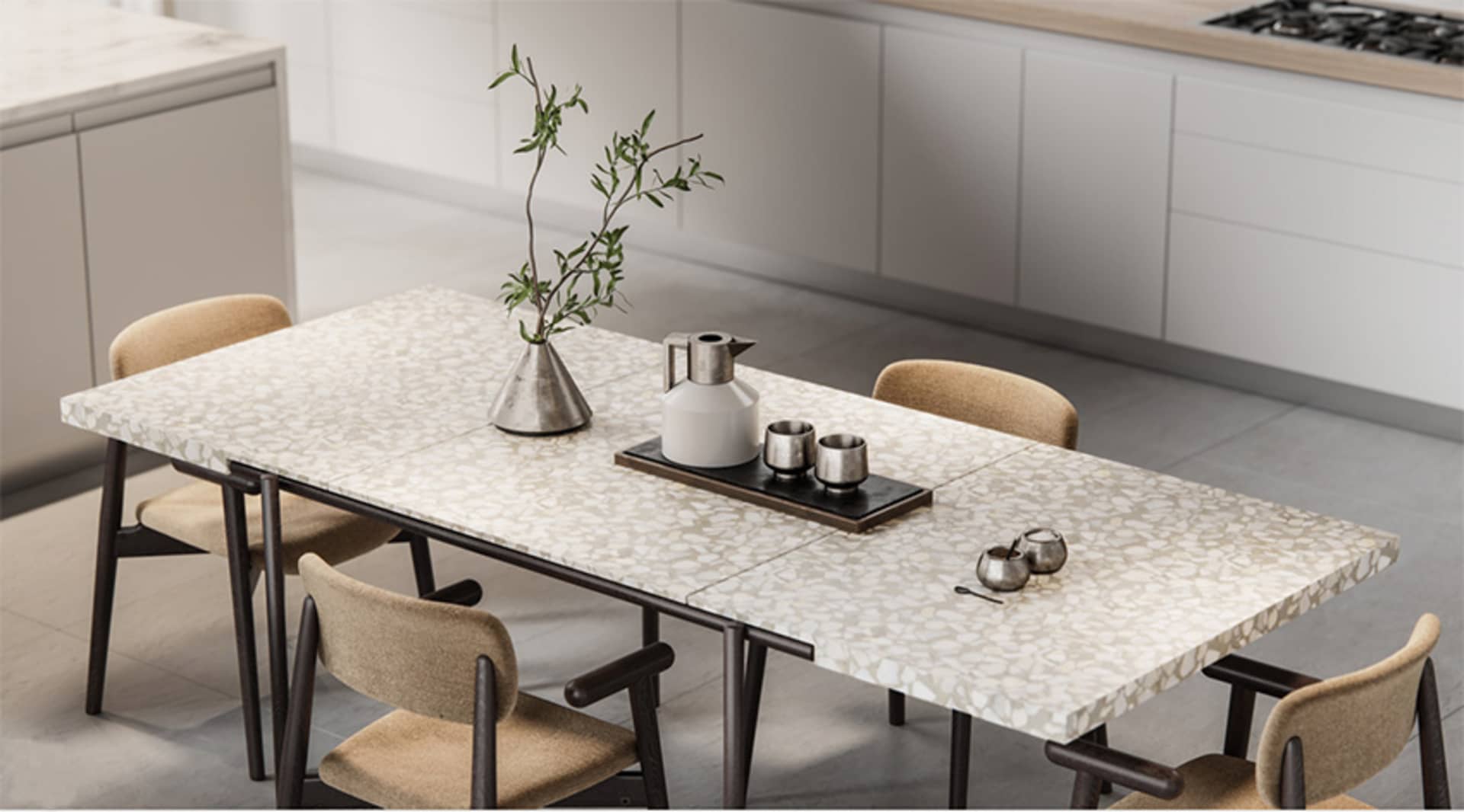 Modern dining room featuring a terrazzo table with a vase of greenery, a kettle, and salt and pepper shakers on a wooden tabl