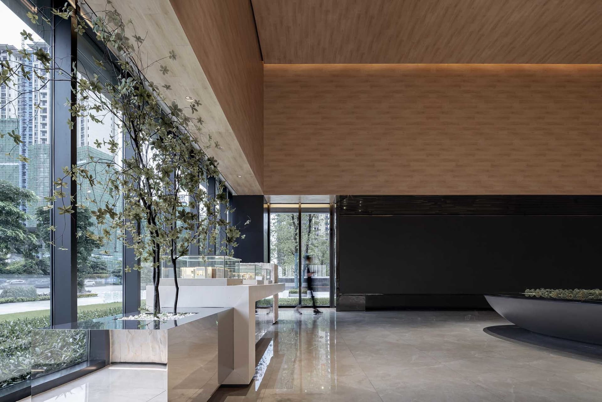 A modern interior design featuring wood elements in a spacious lobby area.