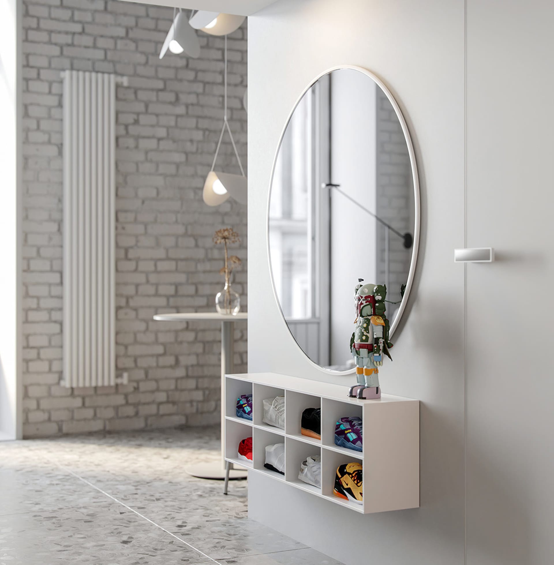 A minimalist entryway featuring concrete walls and flooring, with an oval mirror and a shoe rack below it.
