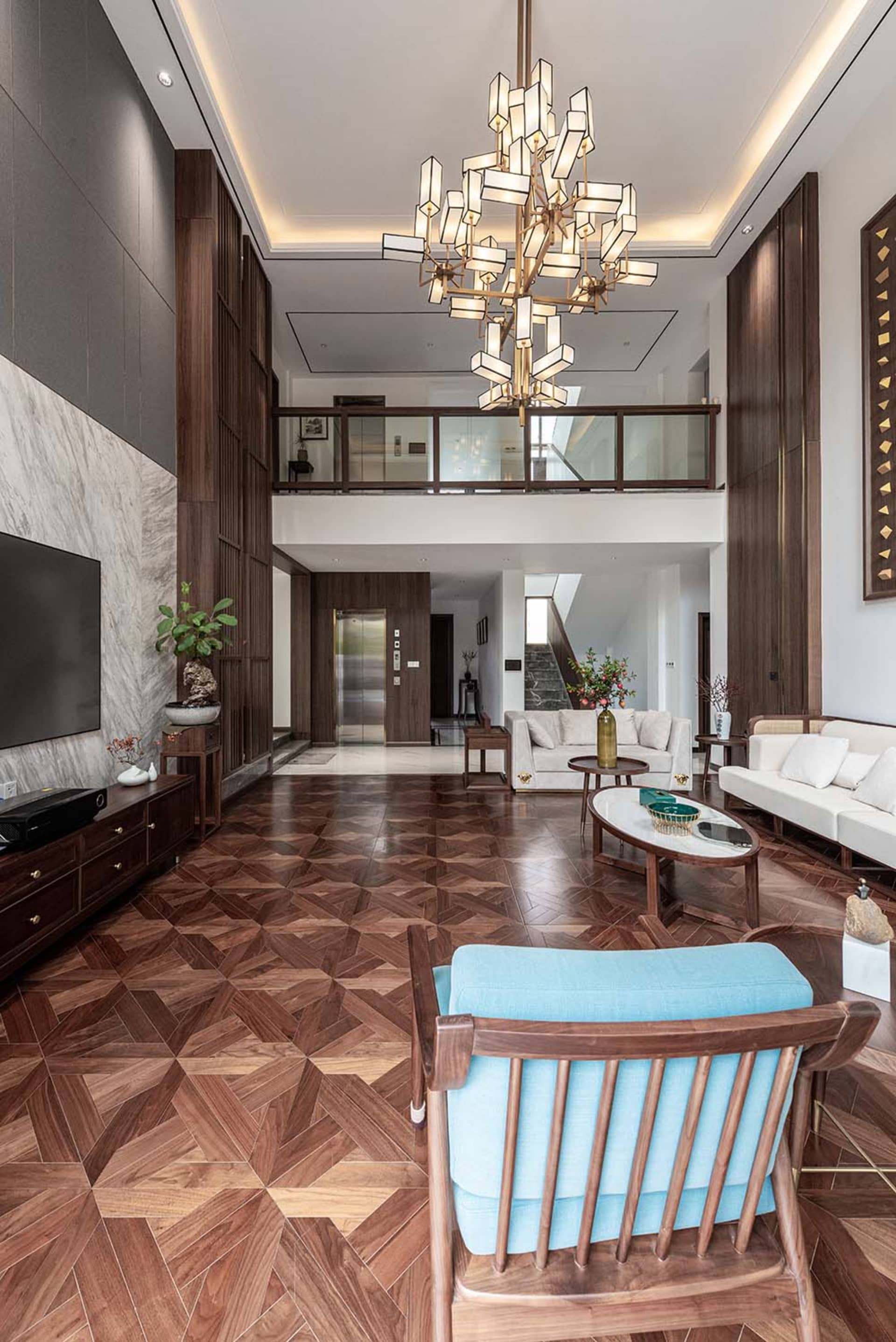 Modern minimalist living room featuring wood and marble elements.