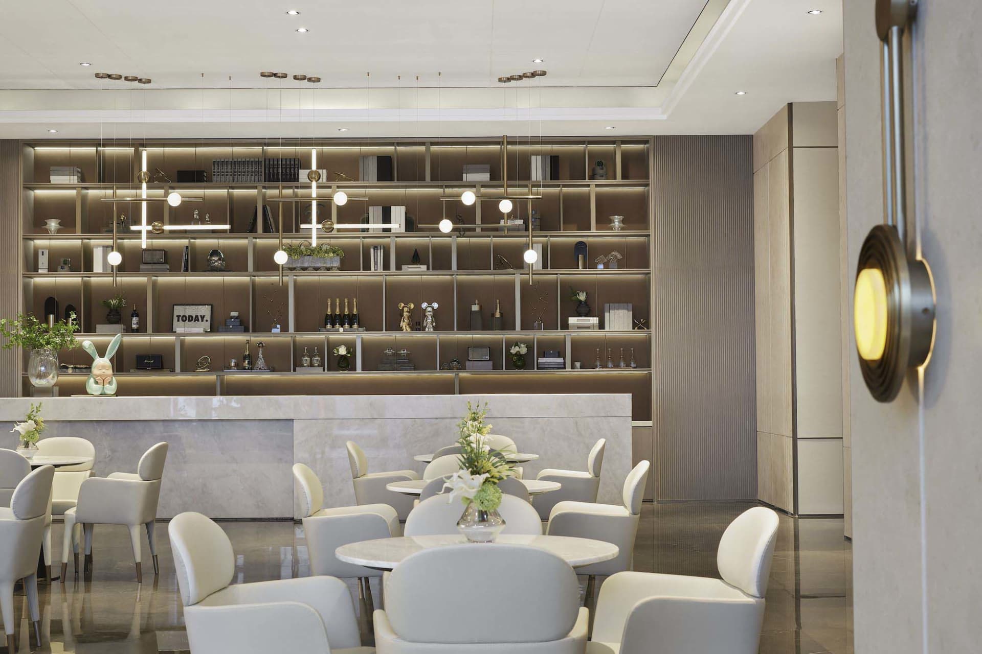 A modern commercial office space with marble finishes and sleek, contemporary furniture.