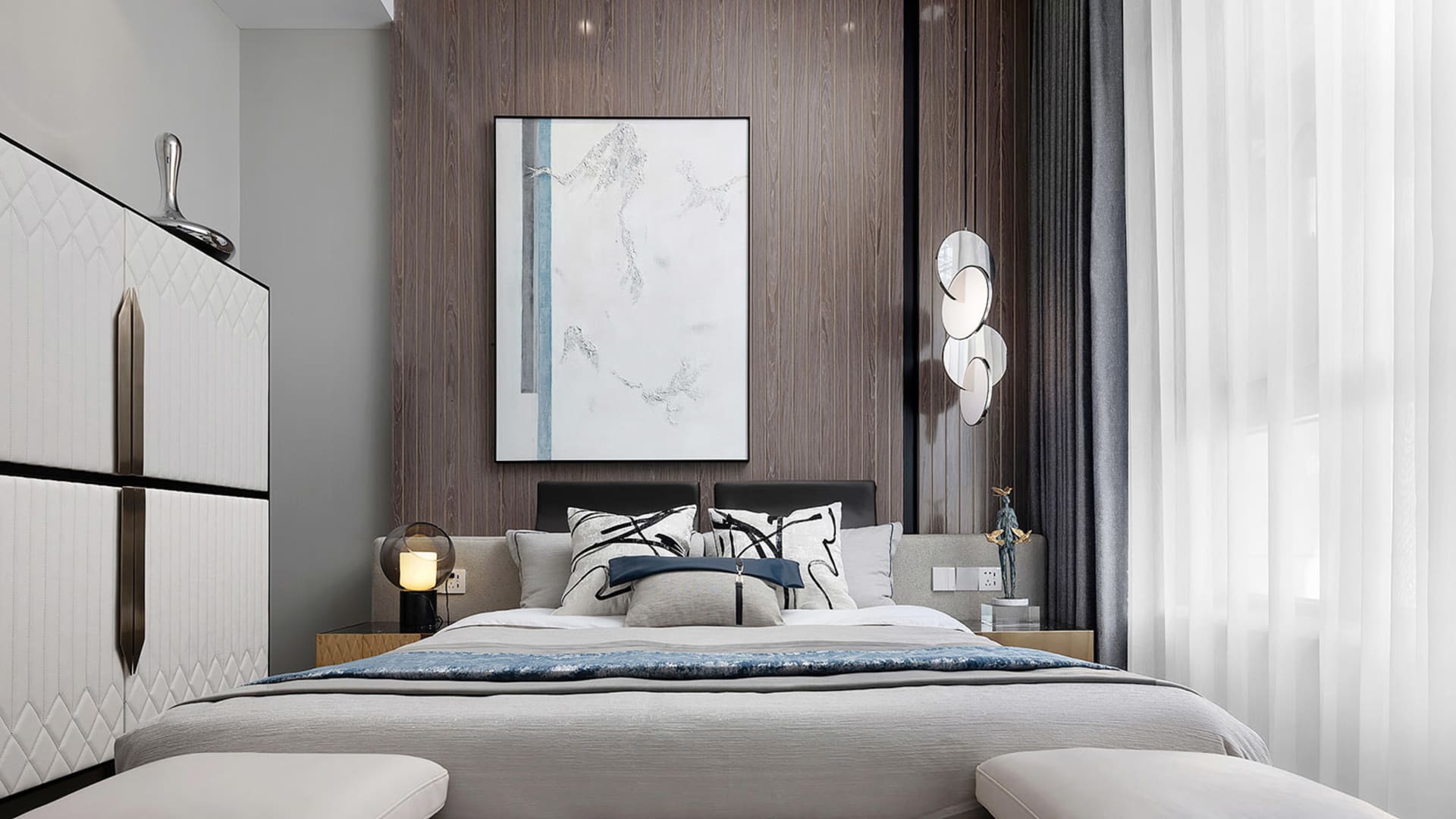 A modern, contemporary bedroom featuring a mix of materials and textures, including a bed with white and black accents, a lar