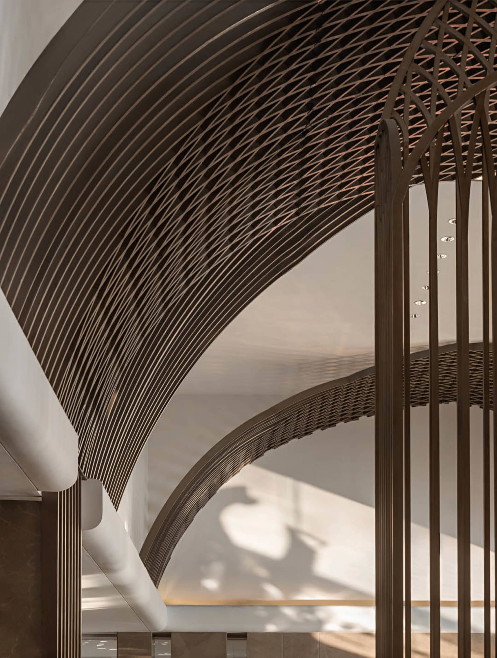Modern interior design featuring a metallic mesh ceiling and curved lines.