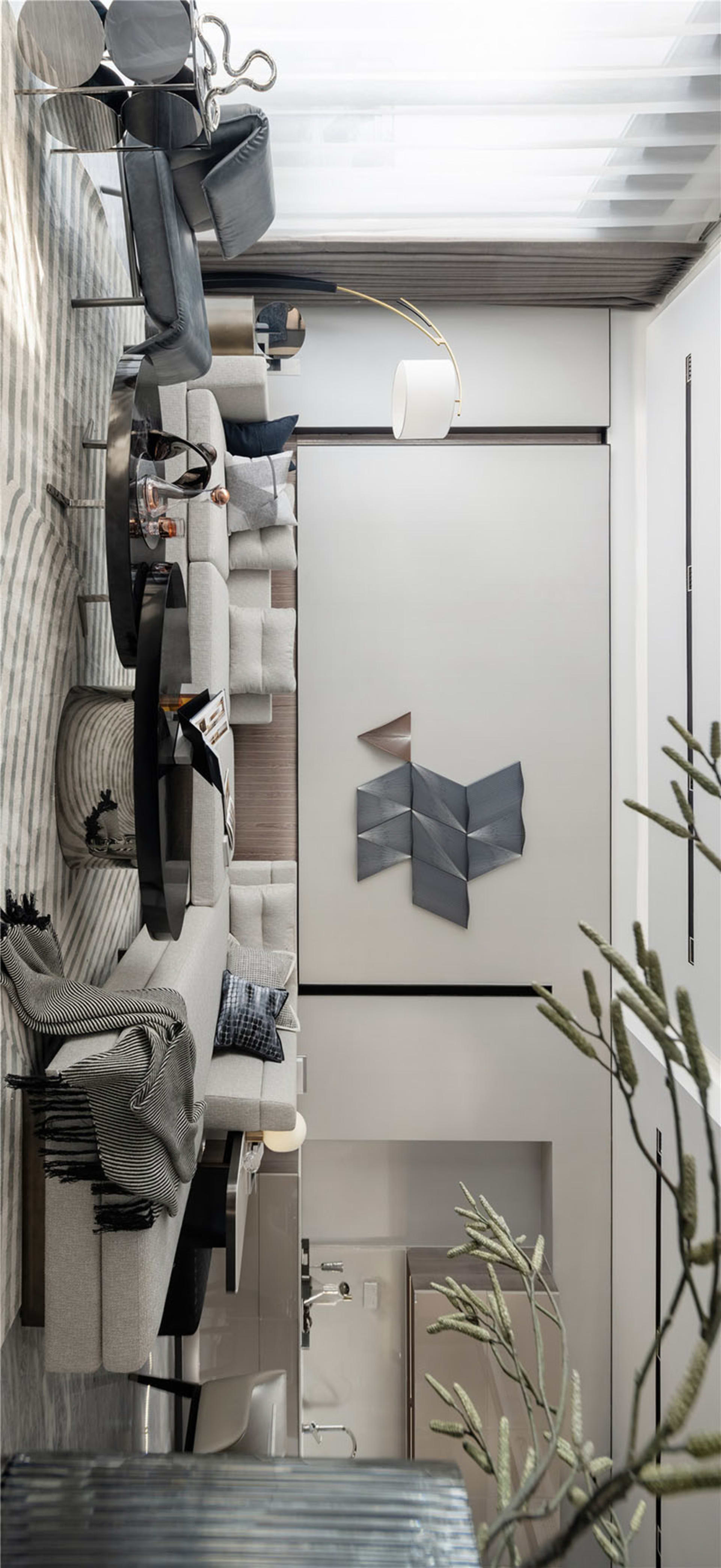 A modern living room with textured fabrics and a minimalist design.