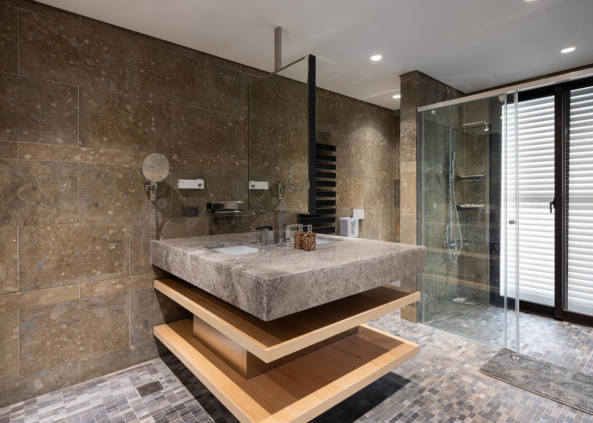 Modern bathroom with stone and concrete materials