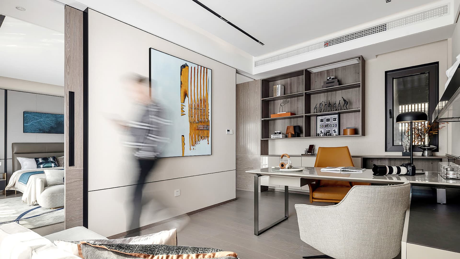 A modern office space featuring wooden furniture and a well-organized desk area.