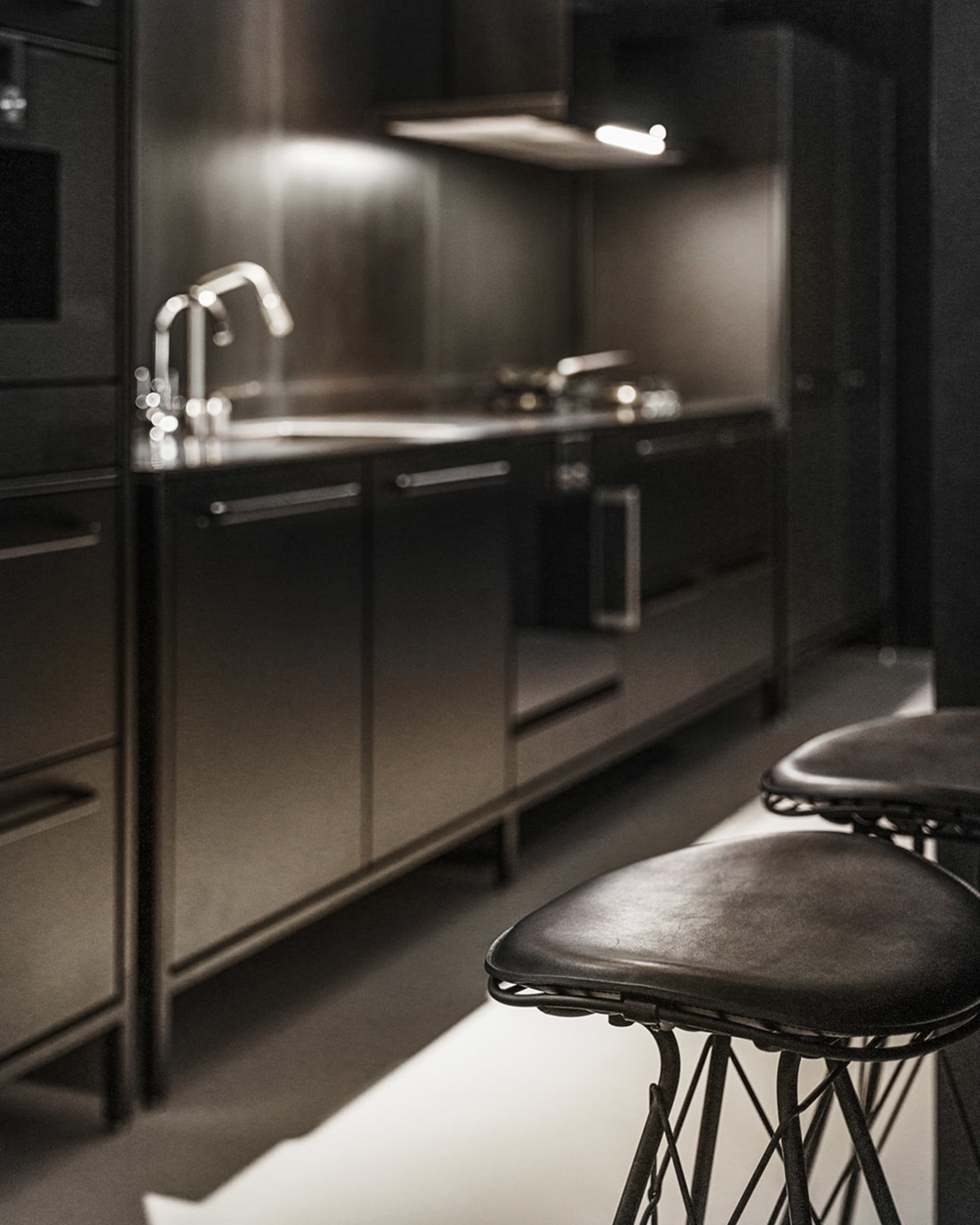 Modest, metallic modern residential kitchen