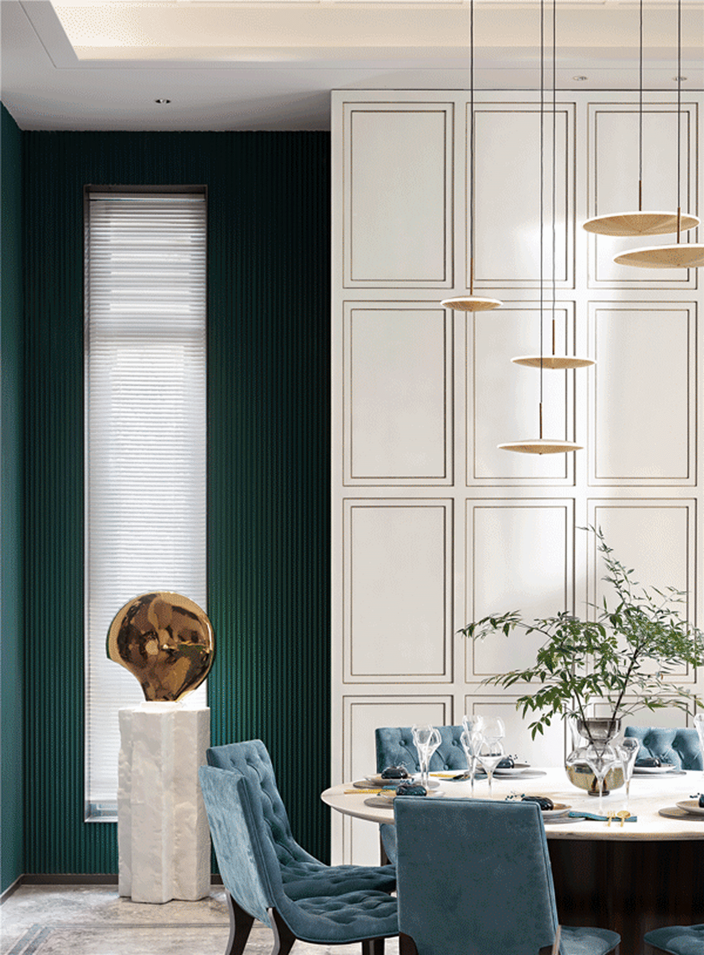 Modern dining room with green walls, white cabinets, blue velvet chairs, and a circular table.