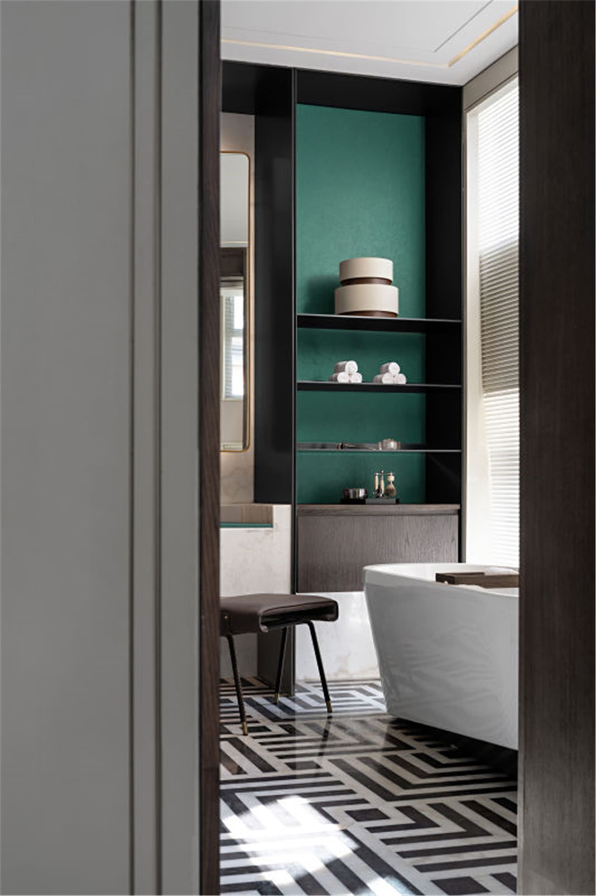 Modern bathroom with marble floor and fixtures.