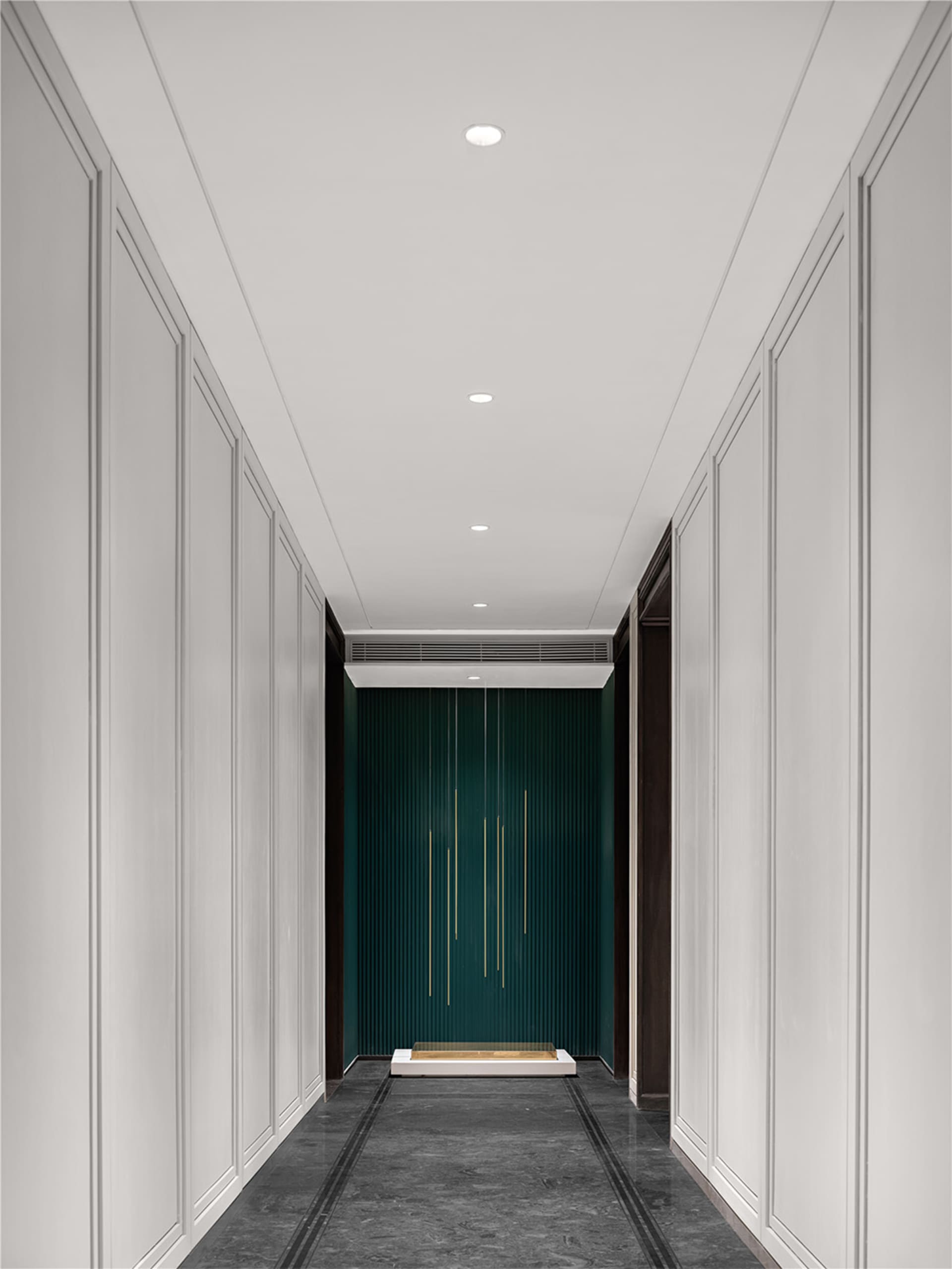 Modern interior design featuring a green feature wall and sleek white walls and floors.