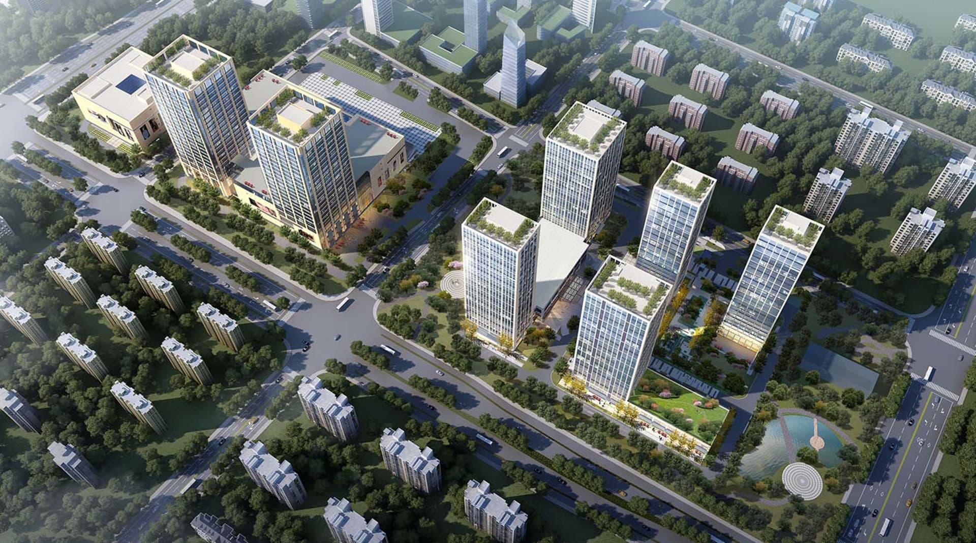 Aerial view of a modern urban development with commercial buildings and residential areas.