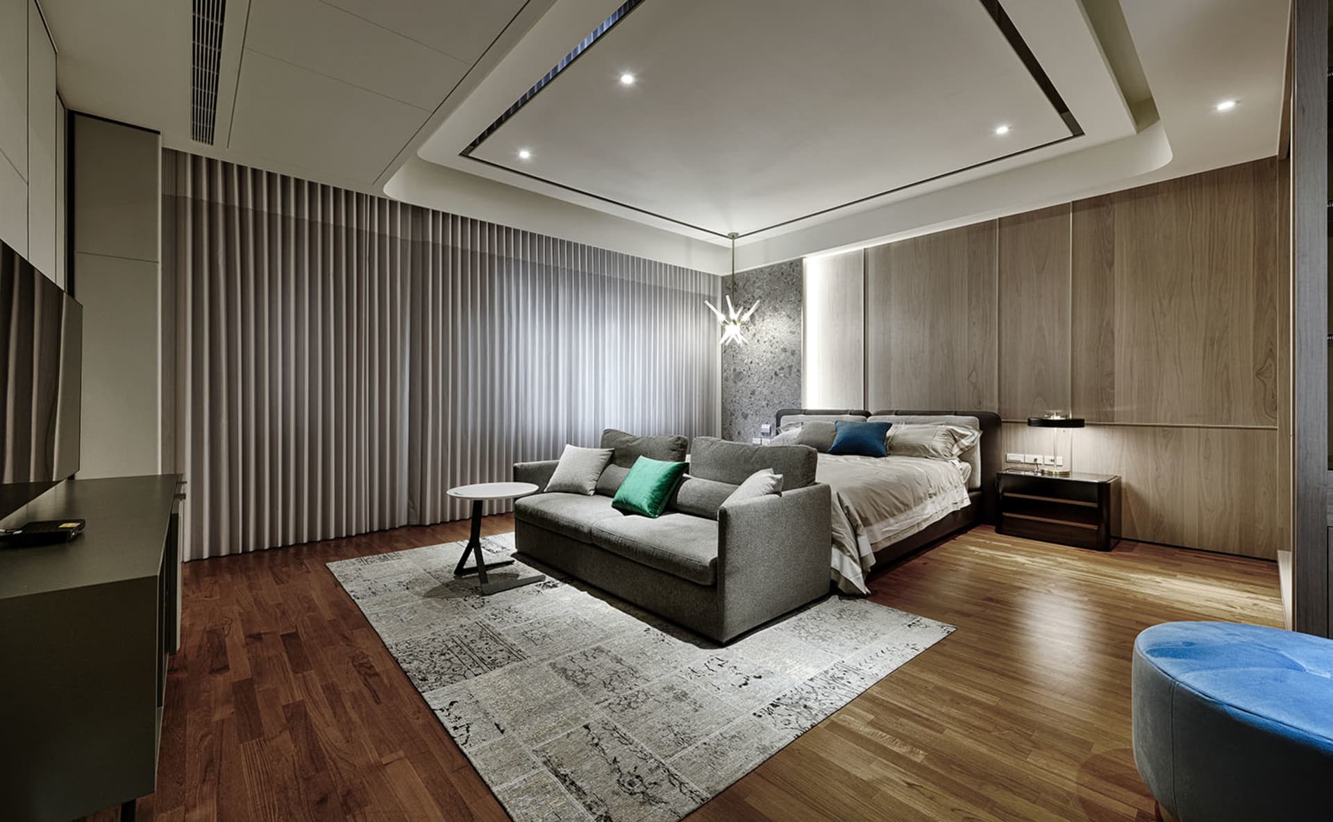Modern minimalist bedroom featuring wooden furniture and fabric upholstery.