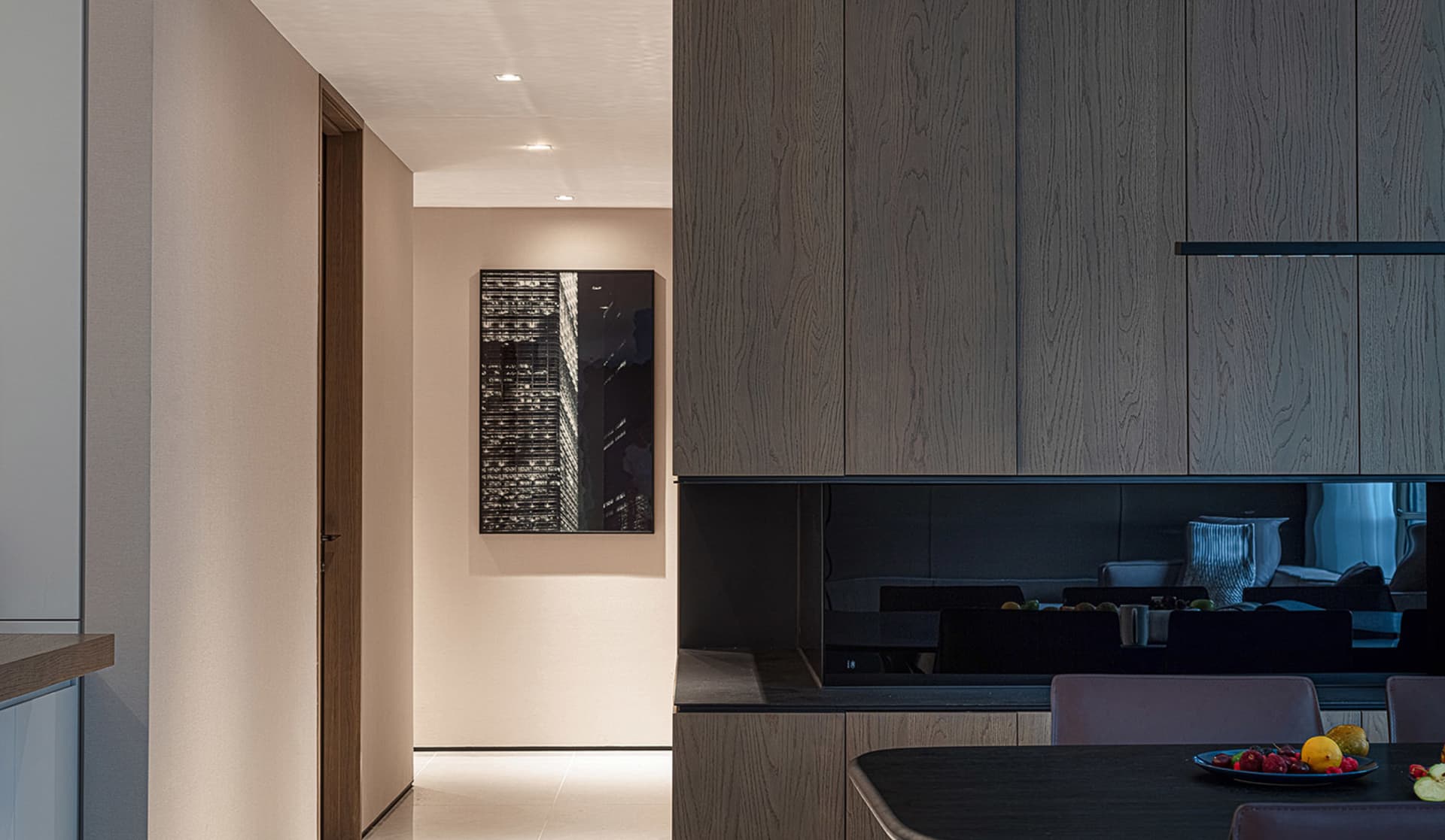 Modern kitchen featuring wooden cabinets and black countertop.
