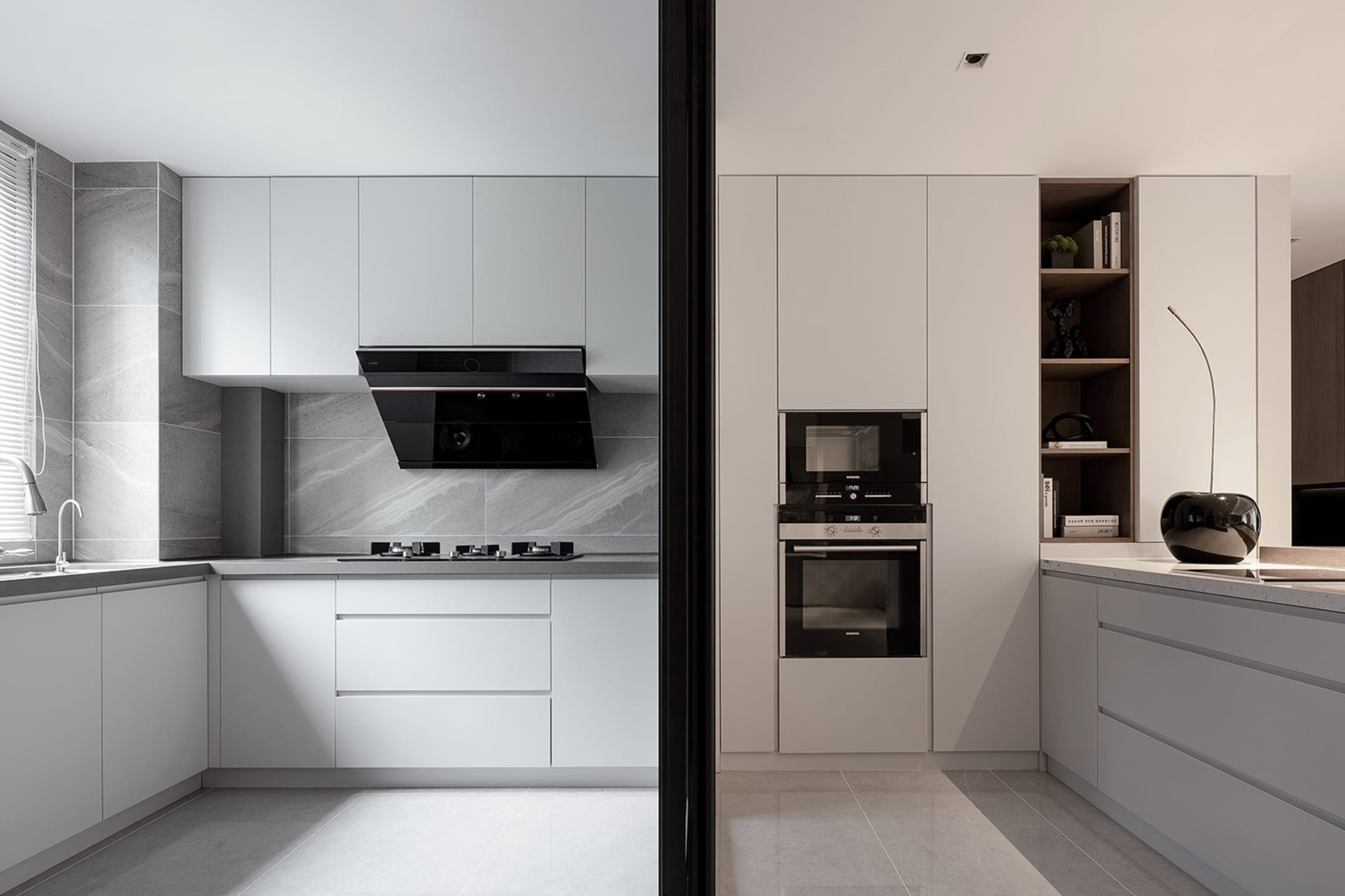 Modern minimalist kitchen with white cabinets, steel appliances, and a marble backsplash.