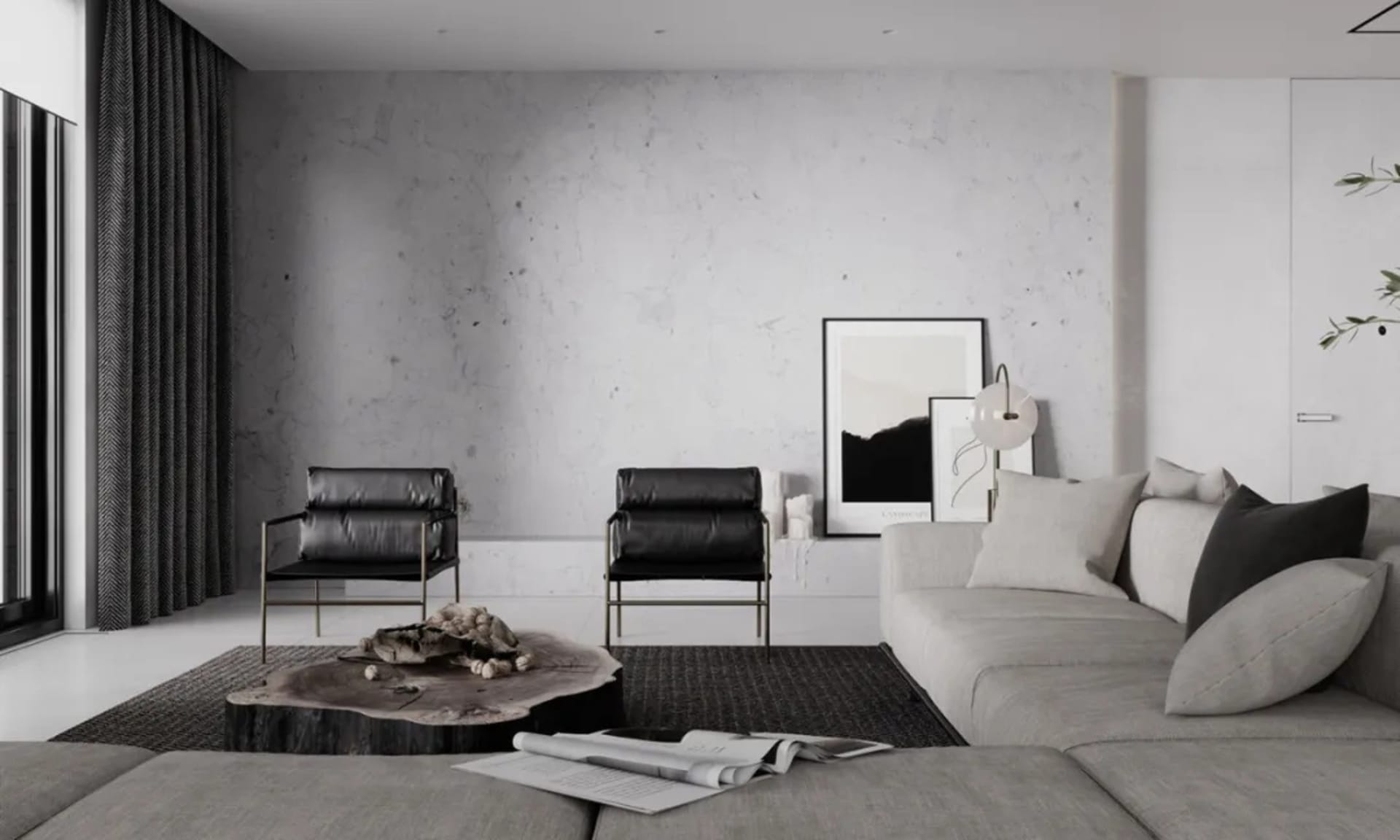 A modern living room with minimalist design, featuring black leather armchairs, a wooden coffee table, a large grey sofa, and