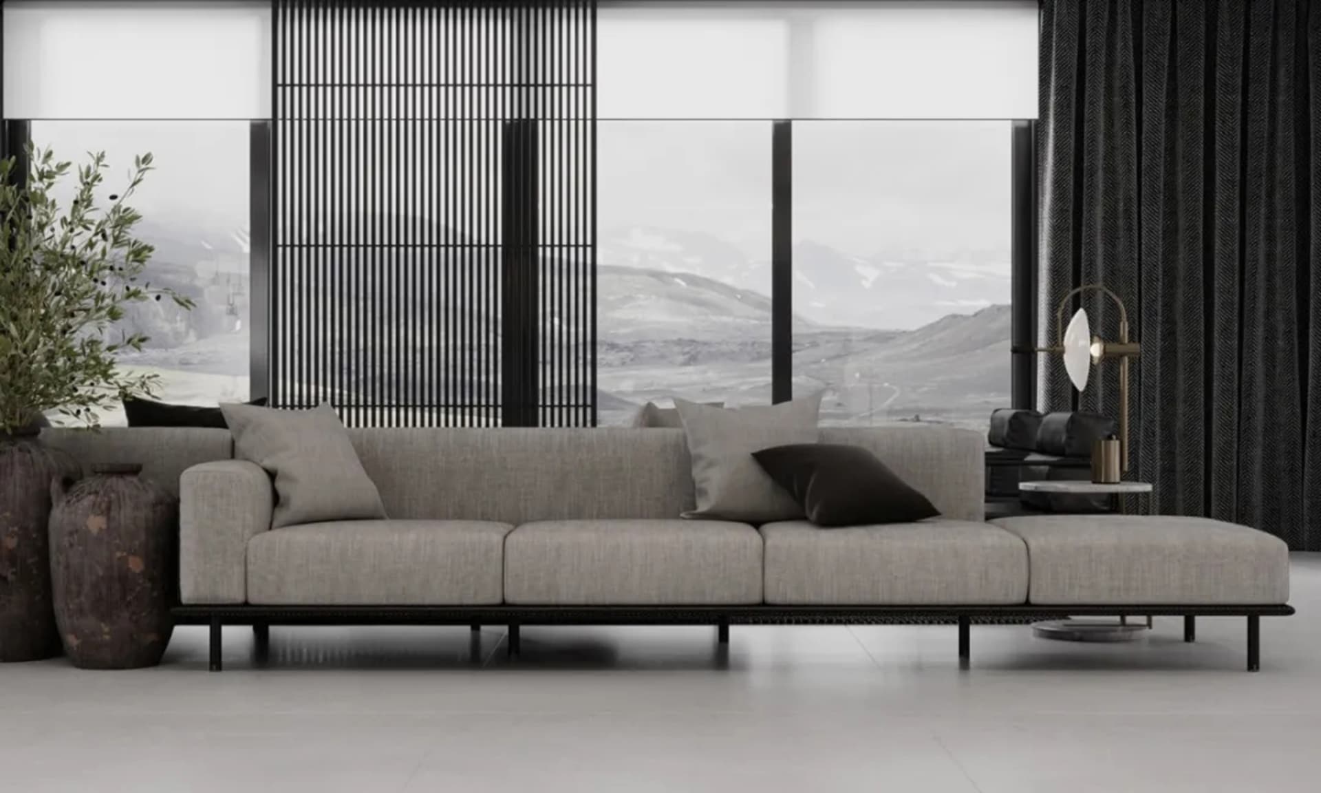 Modern living room featuring a large grey couch with black and grey throw pillows, a black floor lamp, large windows with mou
