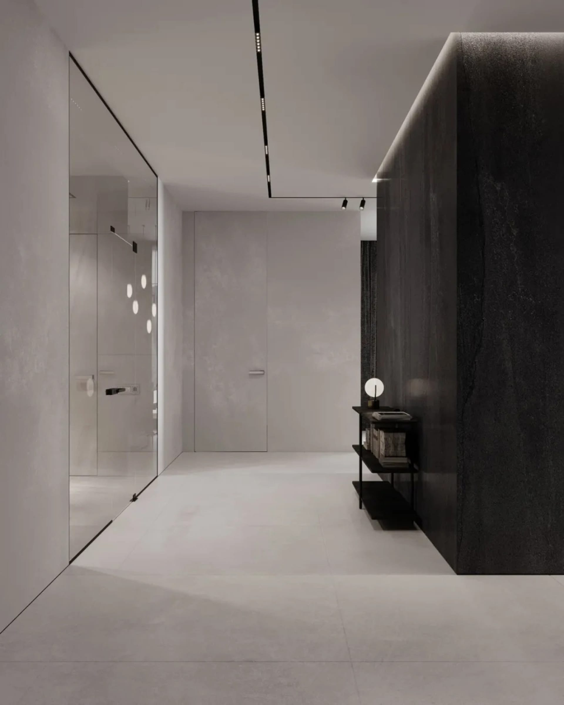 Modern minimalist corridor featuring black marble and concrete materials.