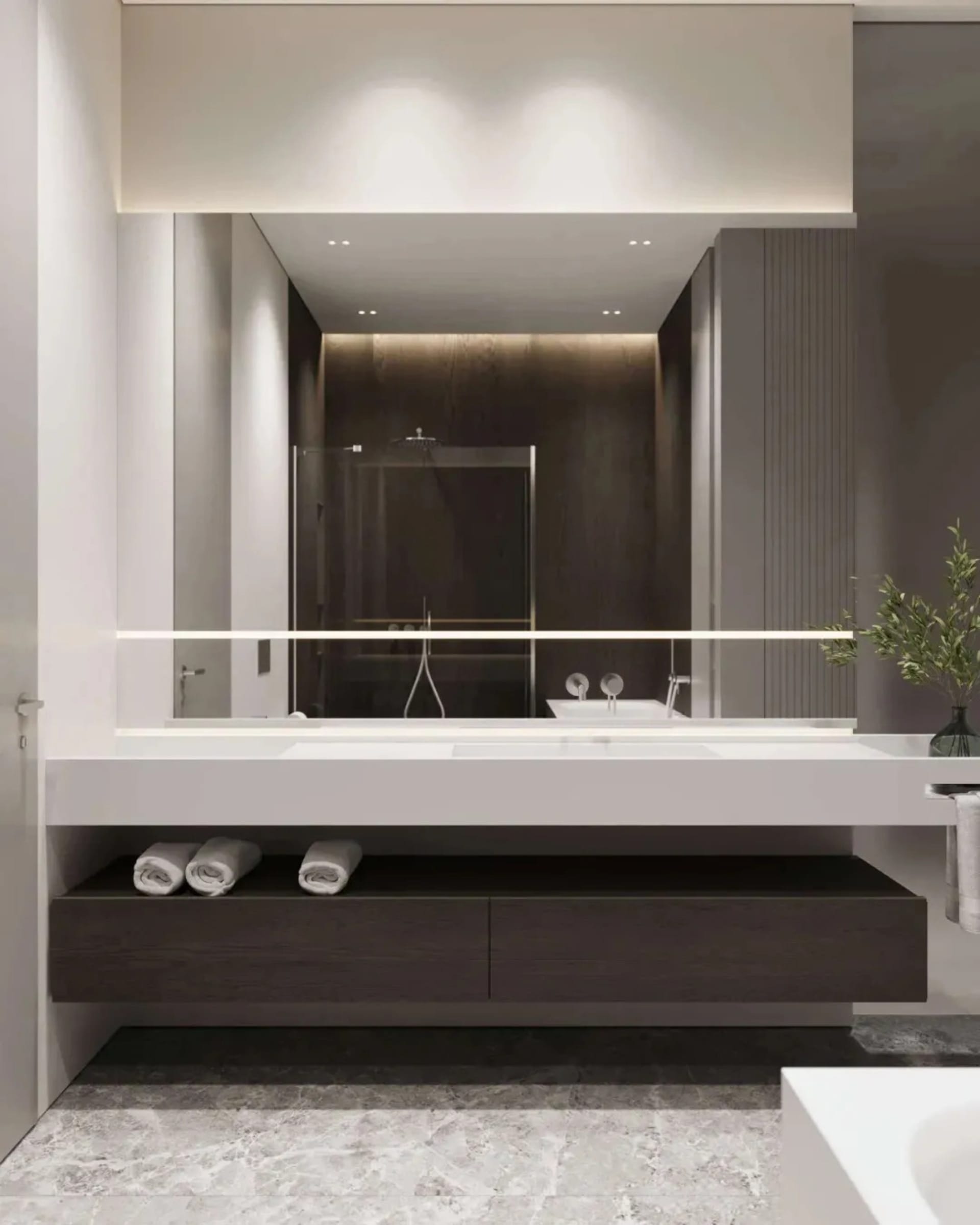 Modern, minimalist bathroom with a floating vanity, glass shower enclosure, and sleek, dark wood cabinetry underneath.