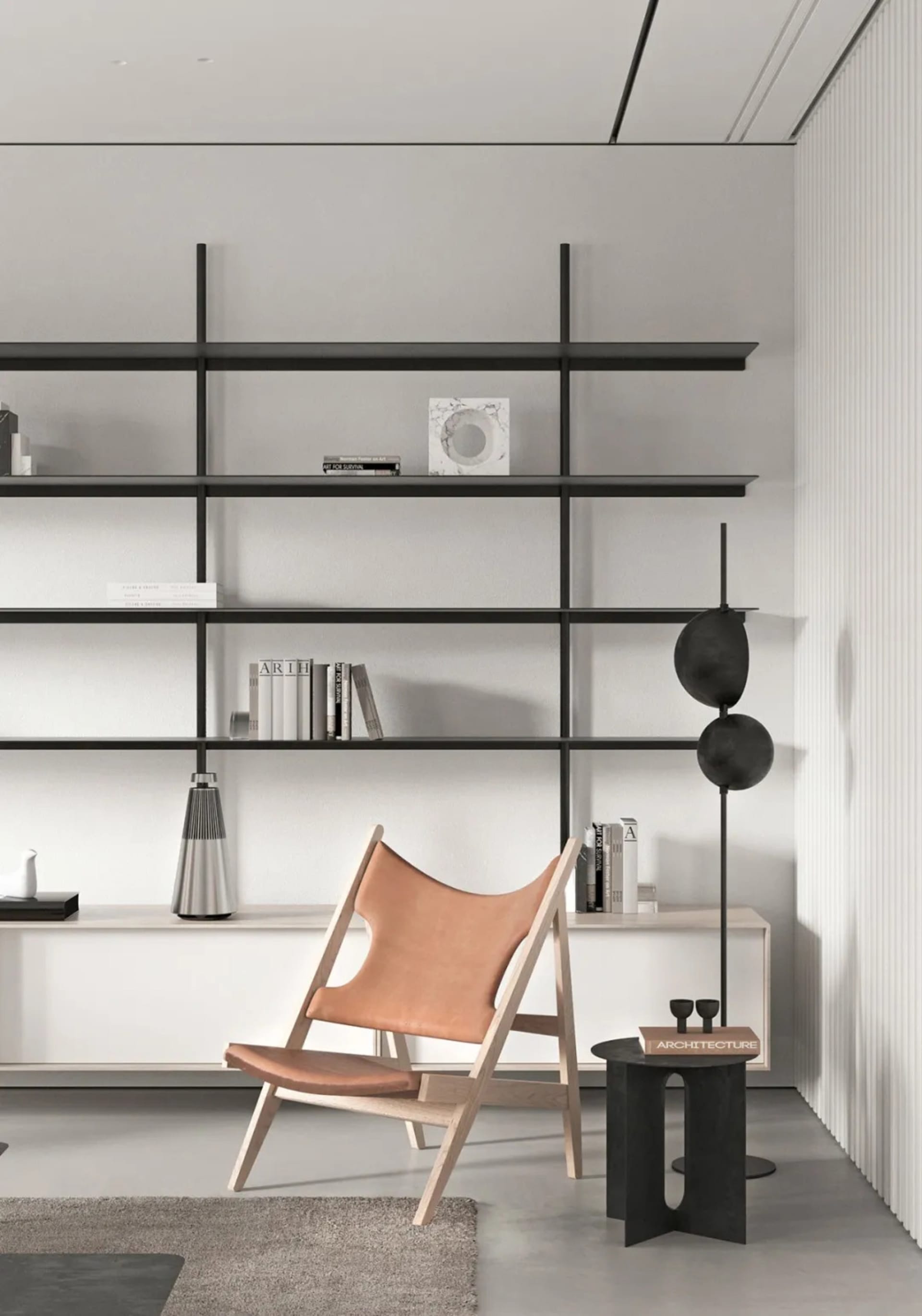 A minimalist living room with a sleek, modern lounge chair, a black floor lamp, and a white floating shelf.
