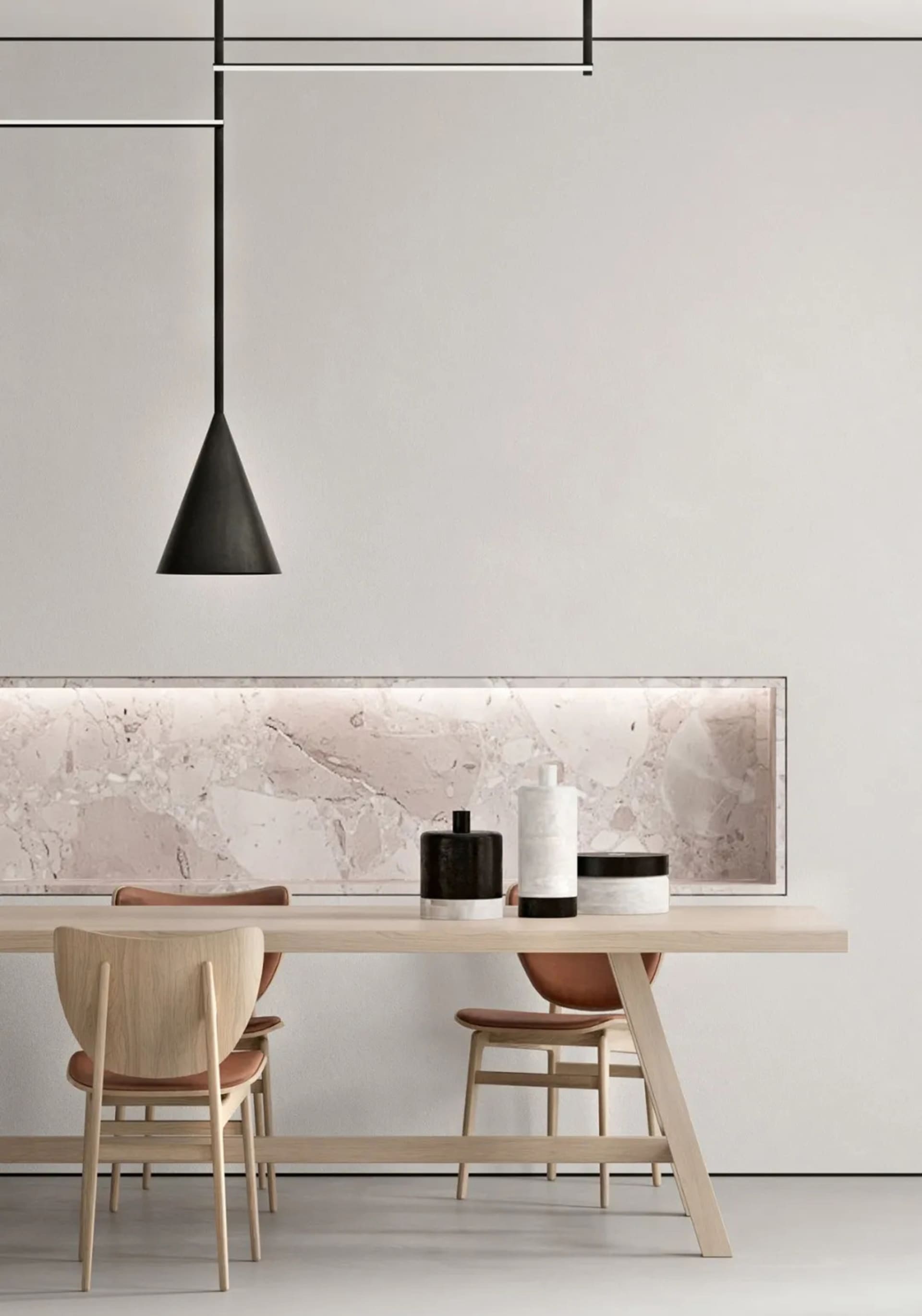 A modern dining room featuring a wooden table with marble top and chairs, minimalist lighting, and minimalist decor.