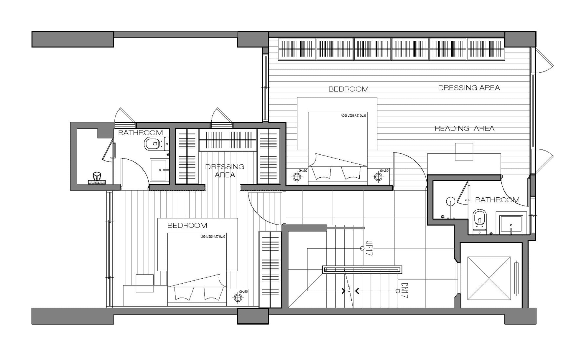 一張詳細的現代工作室公寓2D建築圖,包含臥室、衛浴與更衣區。