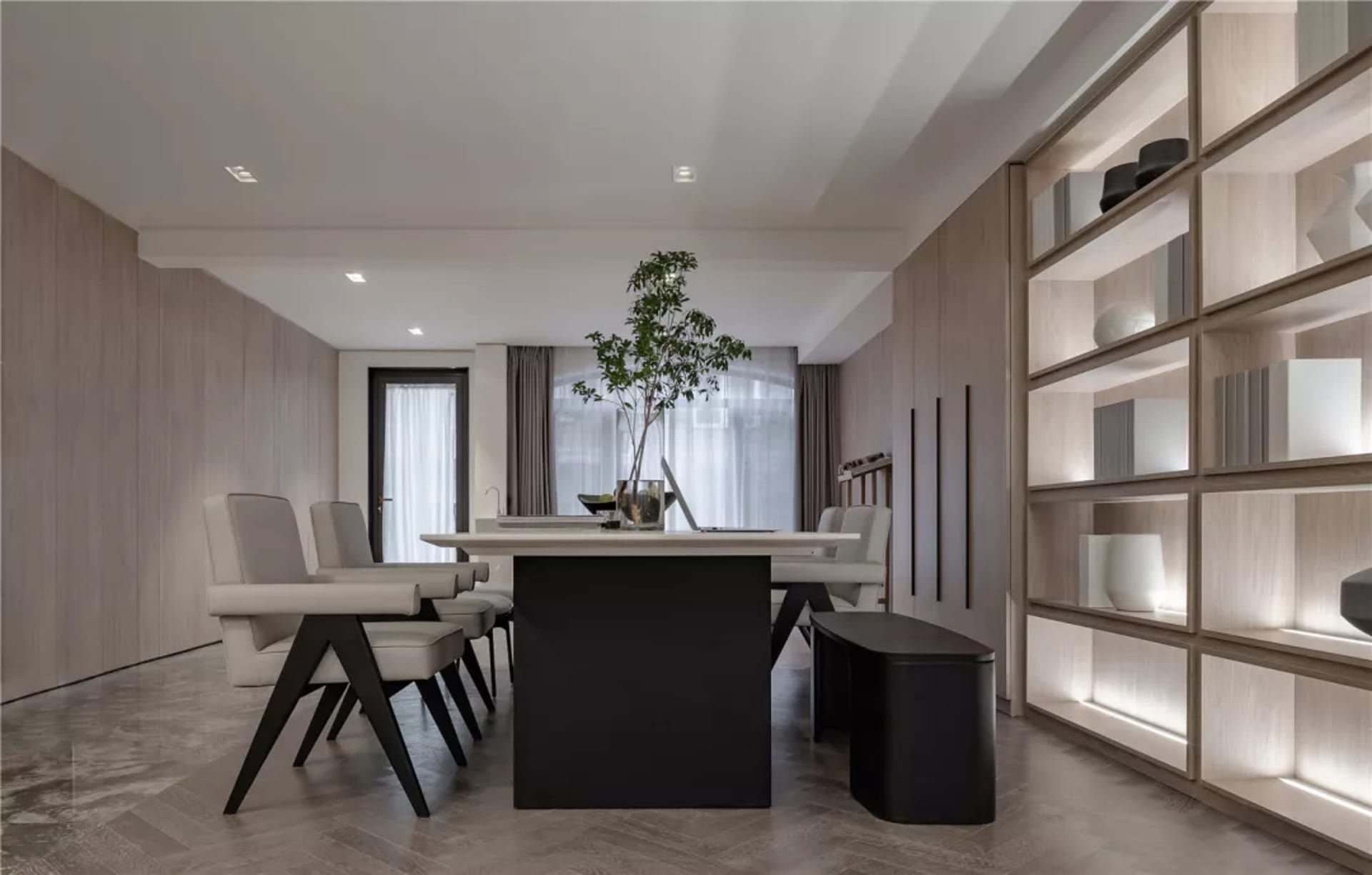 Modern dining room featuring a long wooden table surrounded by six upholstered chairs with contemporary black legs, white cur