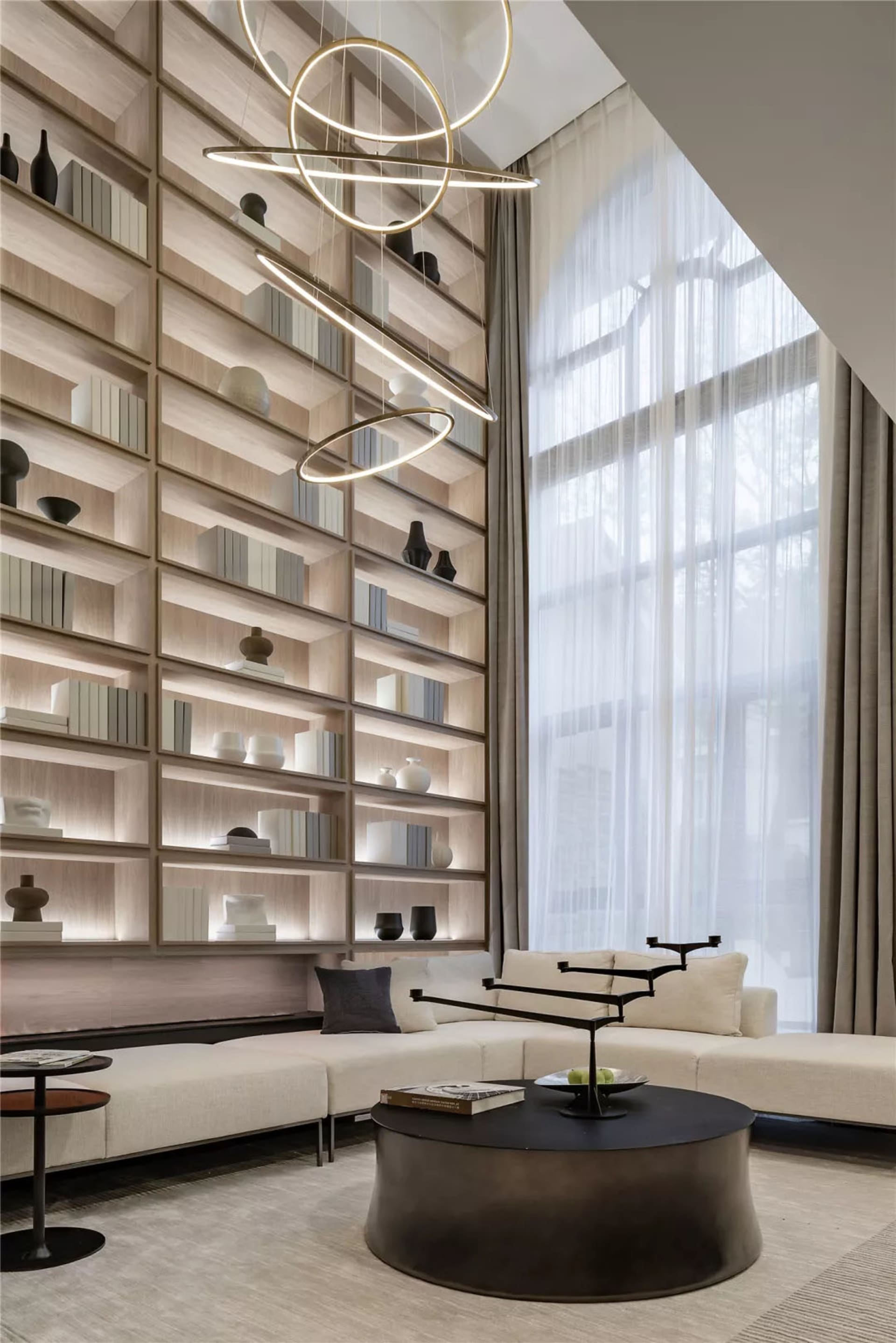 A contemporary living room with a modern interior design, featuring wooden materials, a sectional sofa, and a stylish coffee