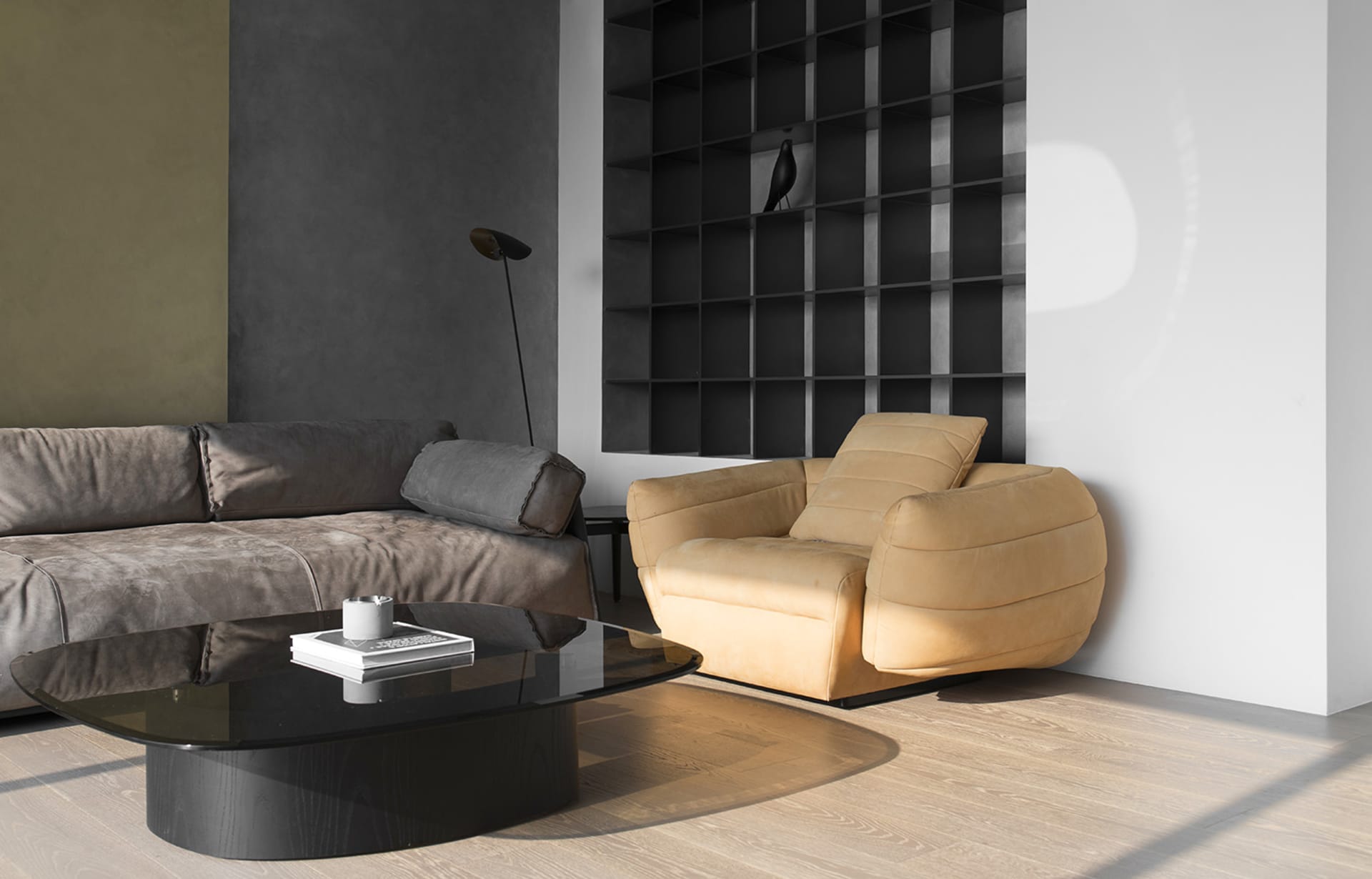 A modern living room with a yellow sofa, dark gray sofa, and black coffee table.