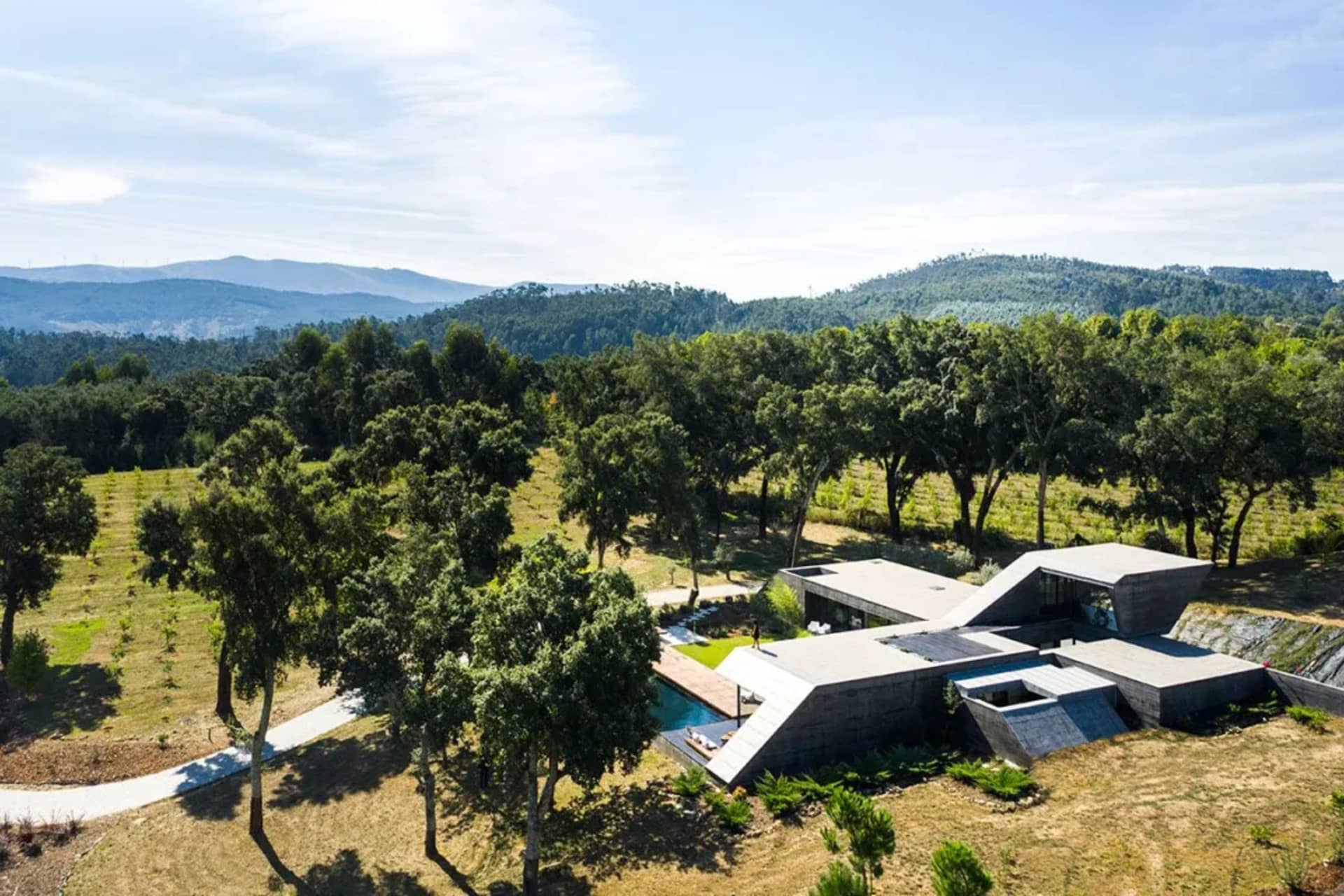 Modern house designed with minimalist architectural style made from concrete materials.