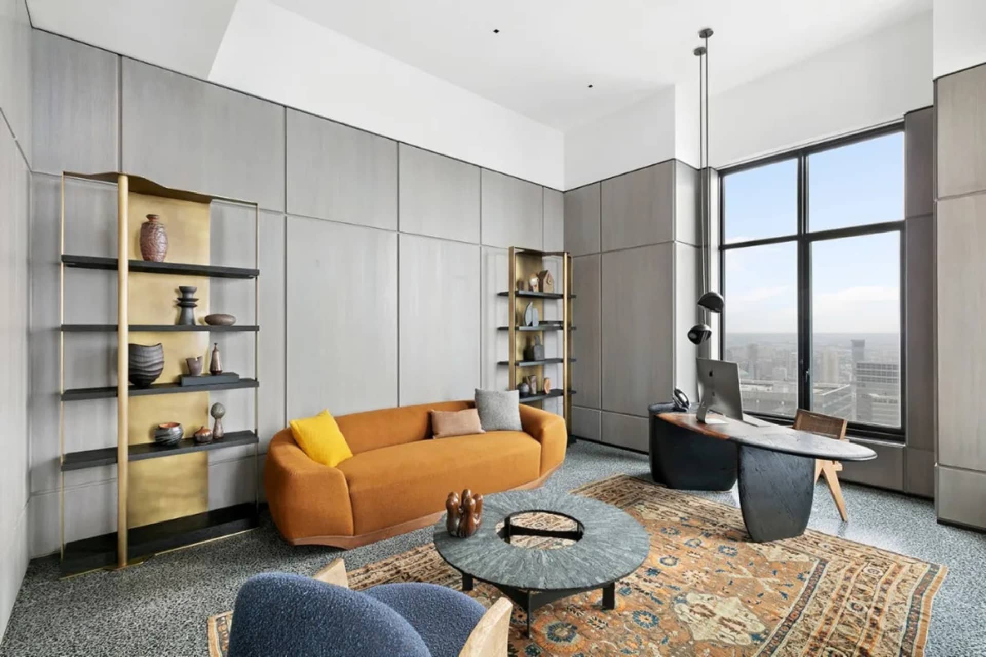 A modern living room featuring minimalist wood furniture and decor.