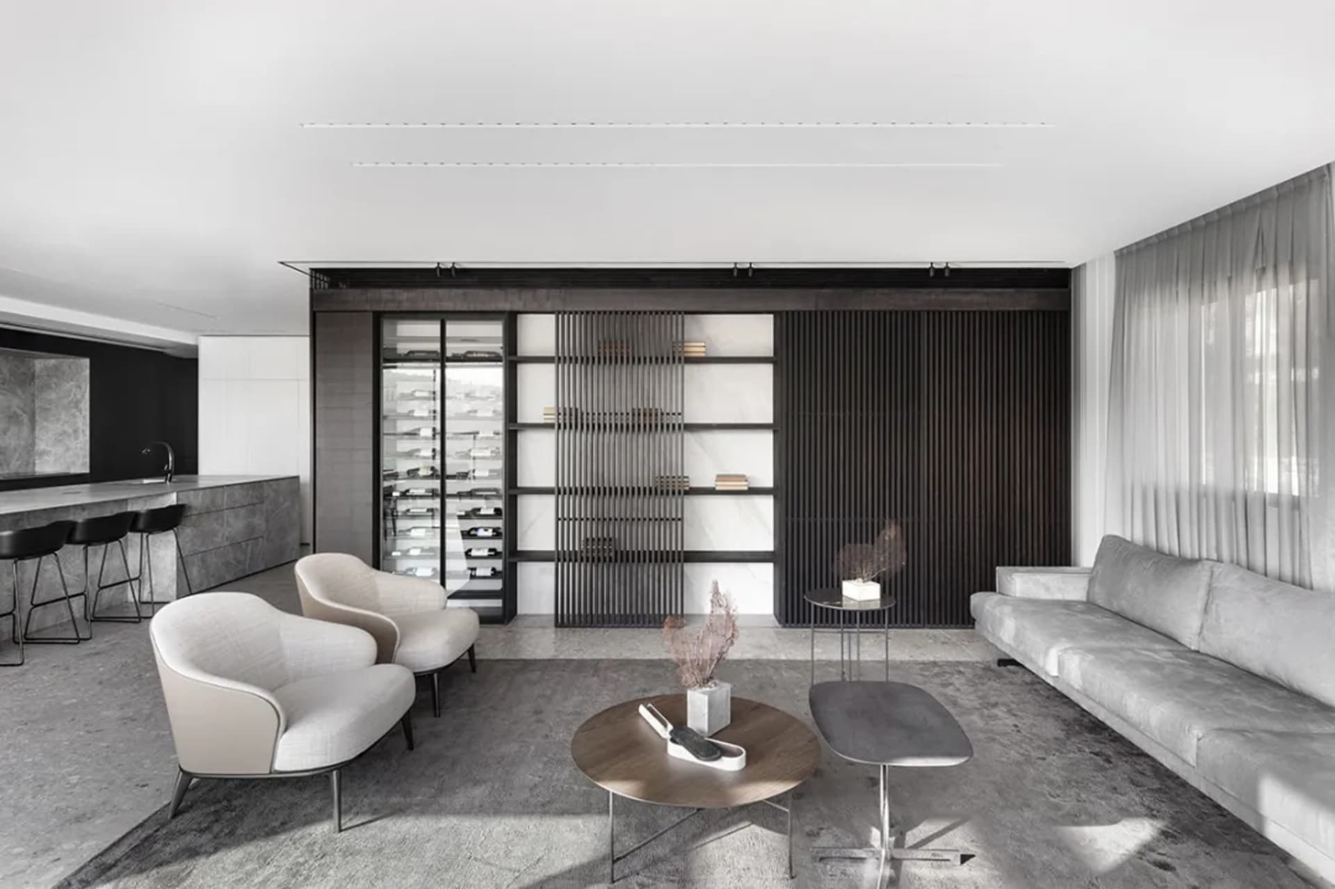Modern living room with concrete, wood, and marble materials