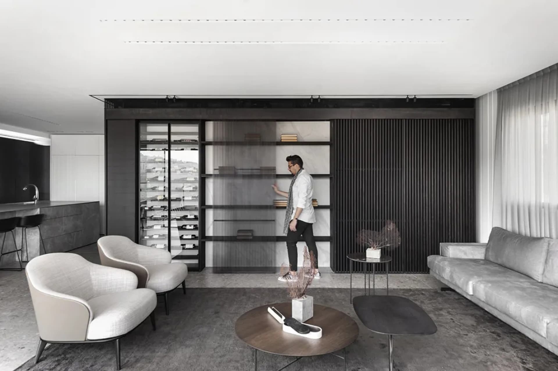 A modern living room featuring wood and marble materials.