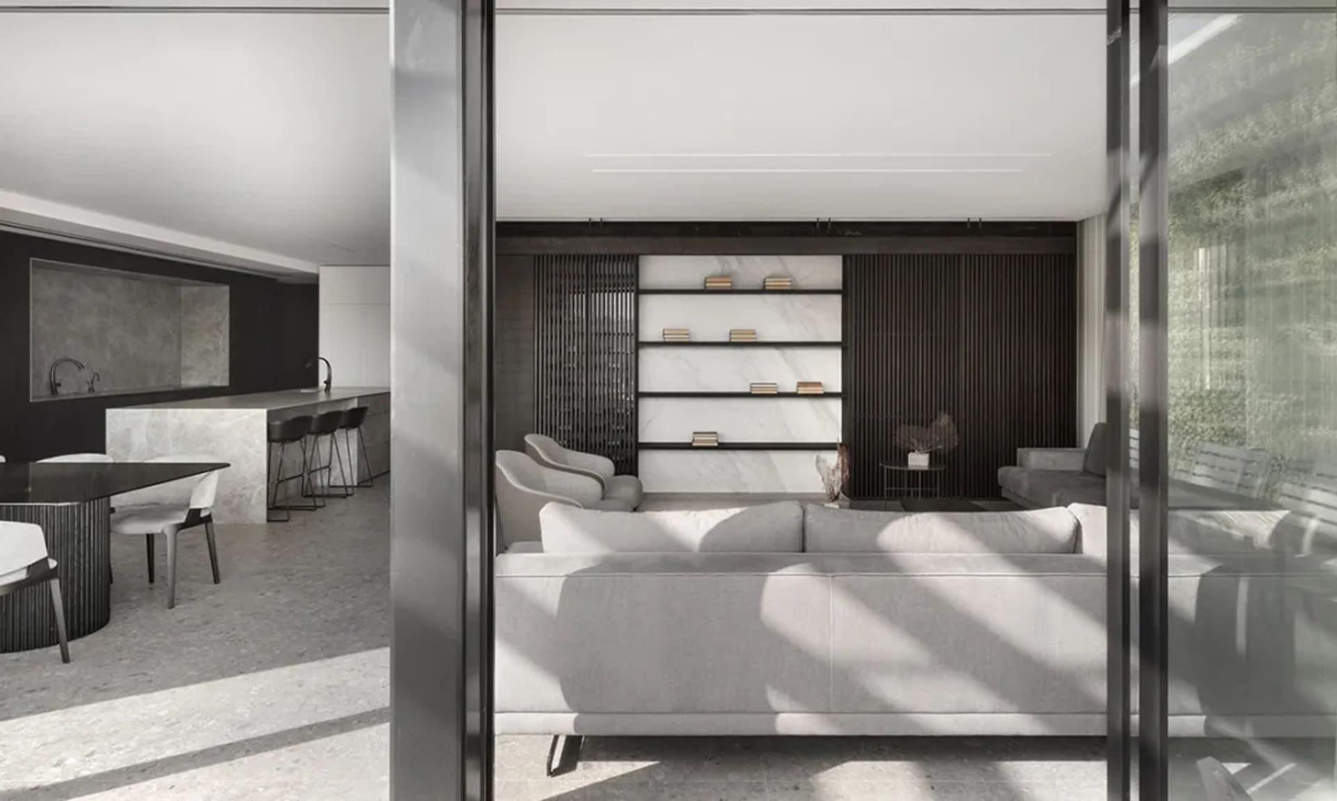 Contemporary living room with marble accents, dark wood, and concrete floor.